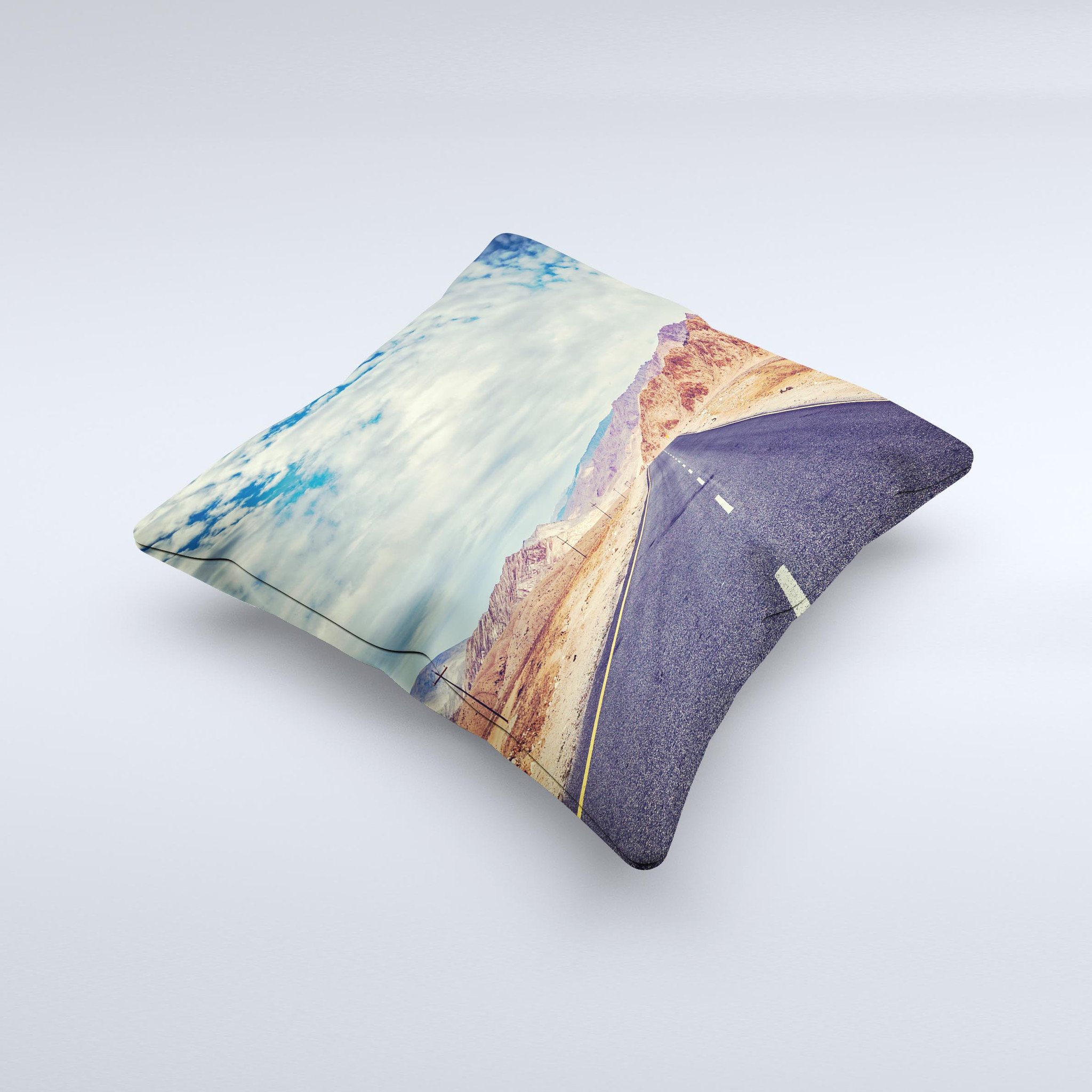 The Desert Road ink-Fuzed Decorative Throw Pillow featuring a unique handcrafted design with high thread count fabric and vibrant colors.