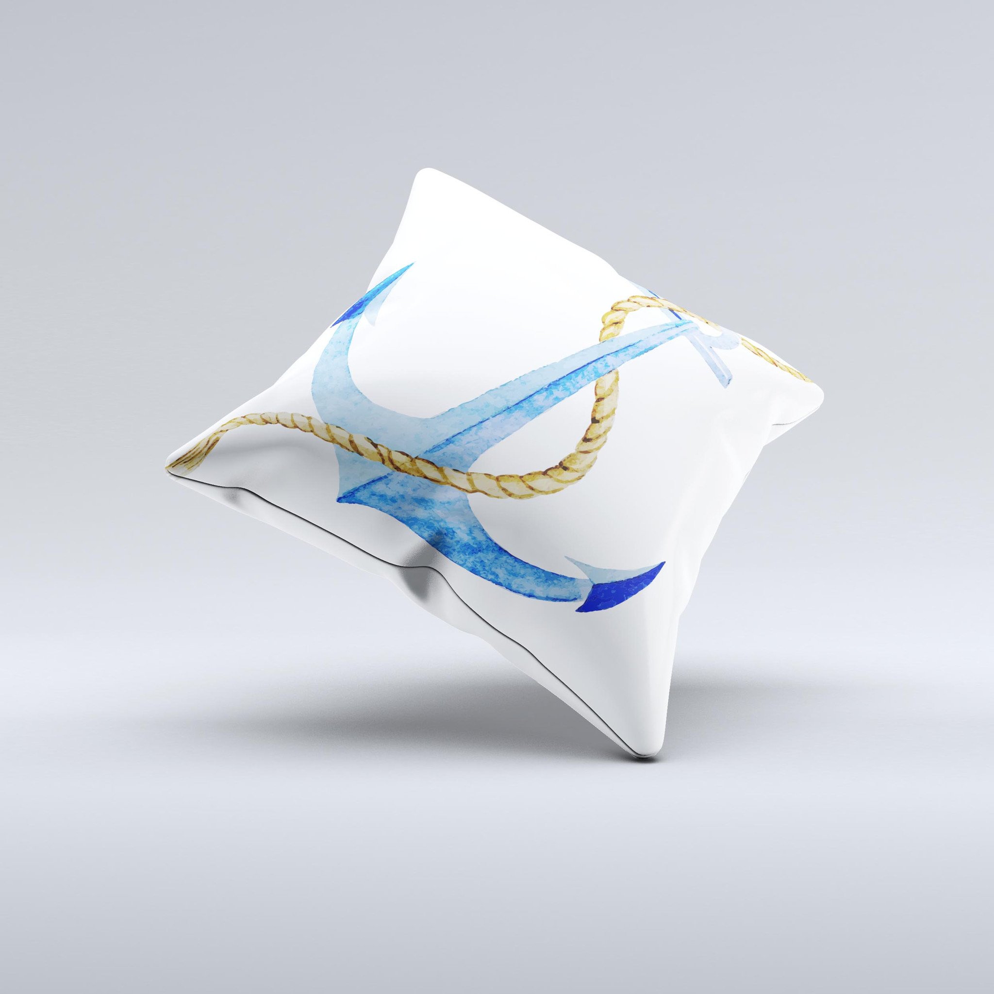 White pillow with blue anchor.