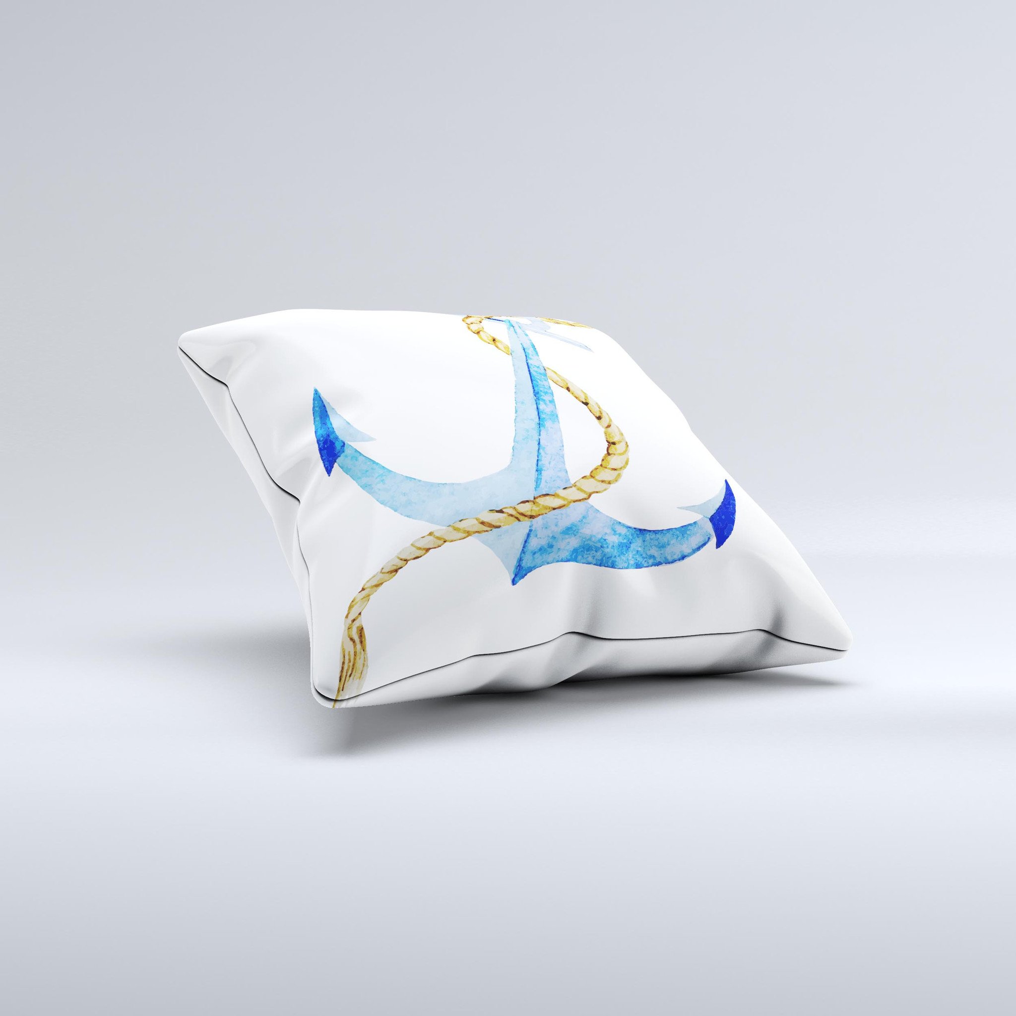 White pillow with blue anchor.