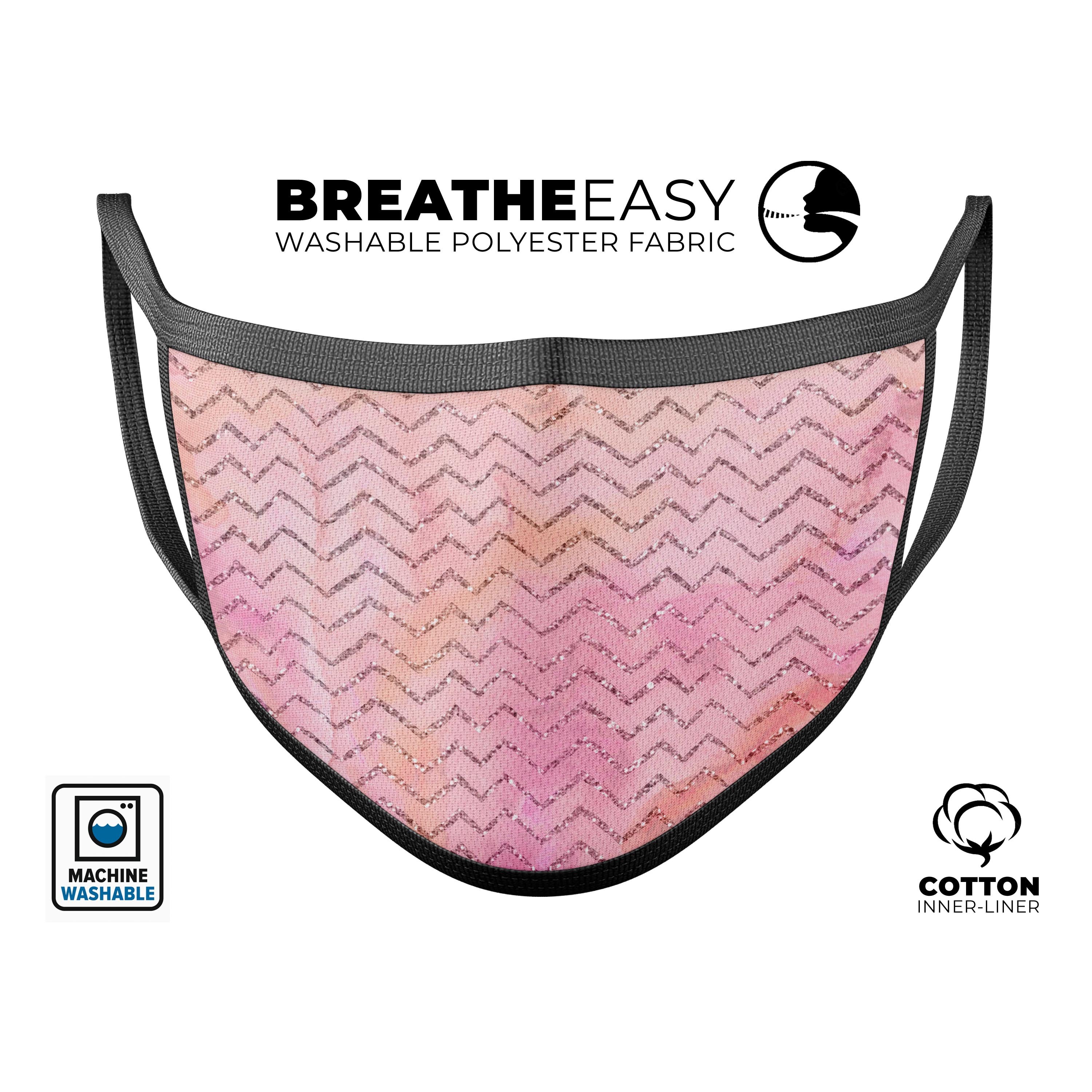 A vibrant pink abstract watercolor face mask with a sparkling chevron pattern, showcasing its unique design and adjustable ear loops.