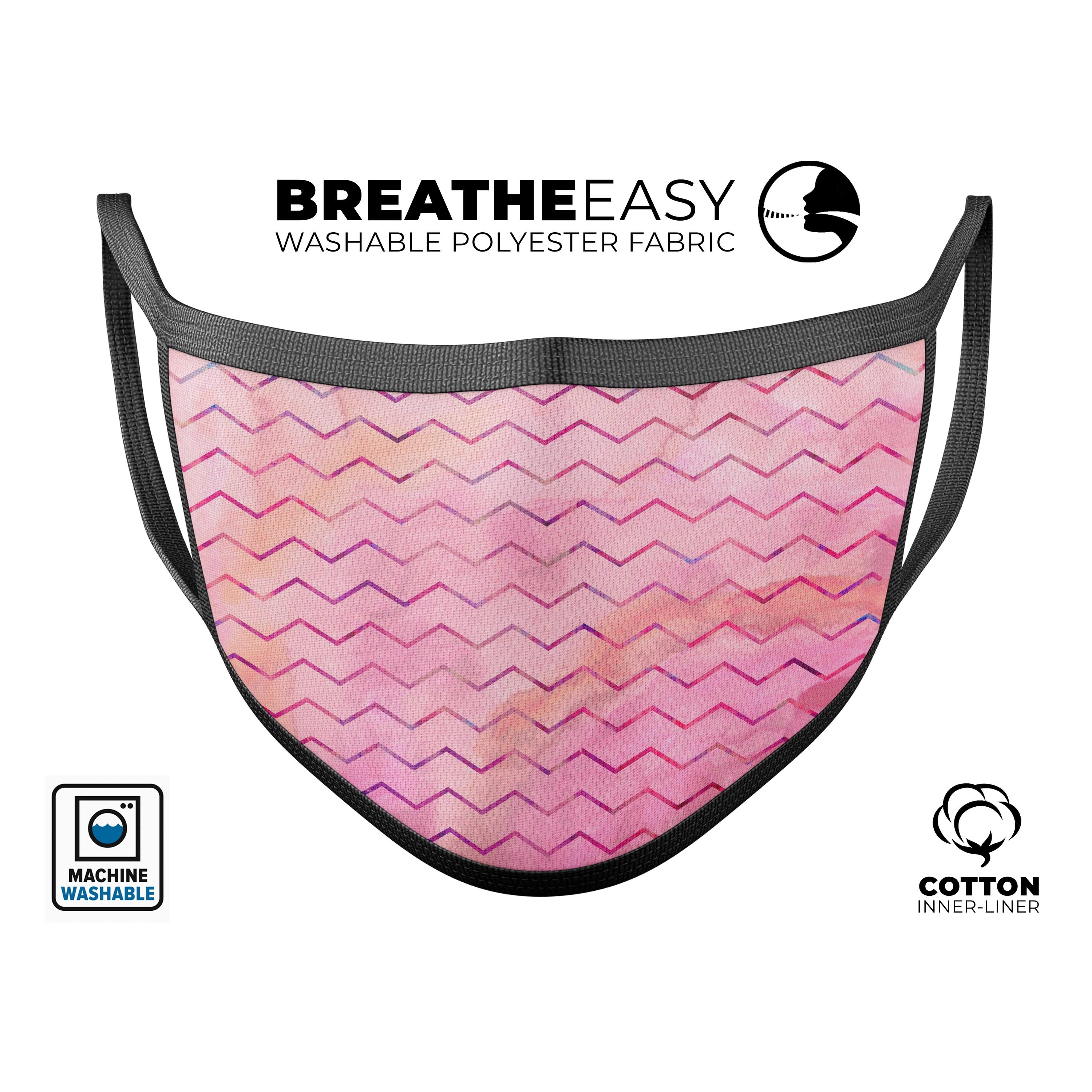 A stylish pink watercolor paint blend face mask with multicolor chevron pattern, adjustable ear loops, and soft cotton interior.