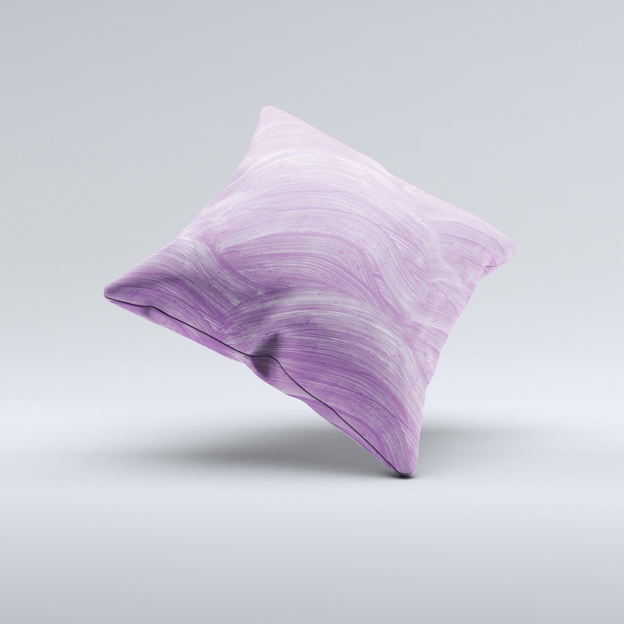 A beautifully handcrafted decorative throw pillow featuring purple brush strokes, showcasing unique imperfections and high-quality fabric.