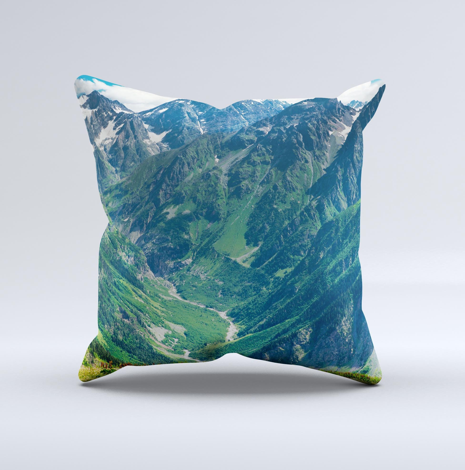 A beautifully crafted Scenic Mountaintops ink-Fuzed Decorative Throw Pillow showcasing a serene mountain landscape design, perfect for home decor.