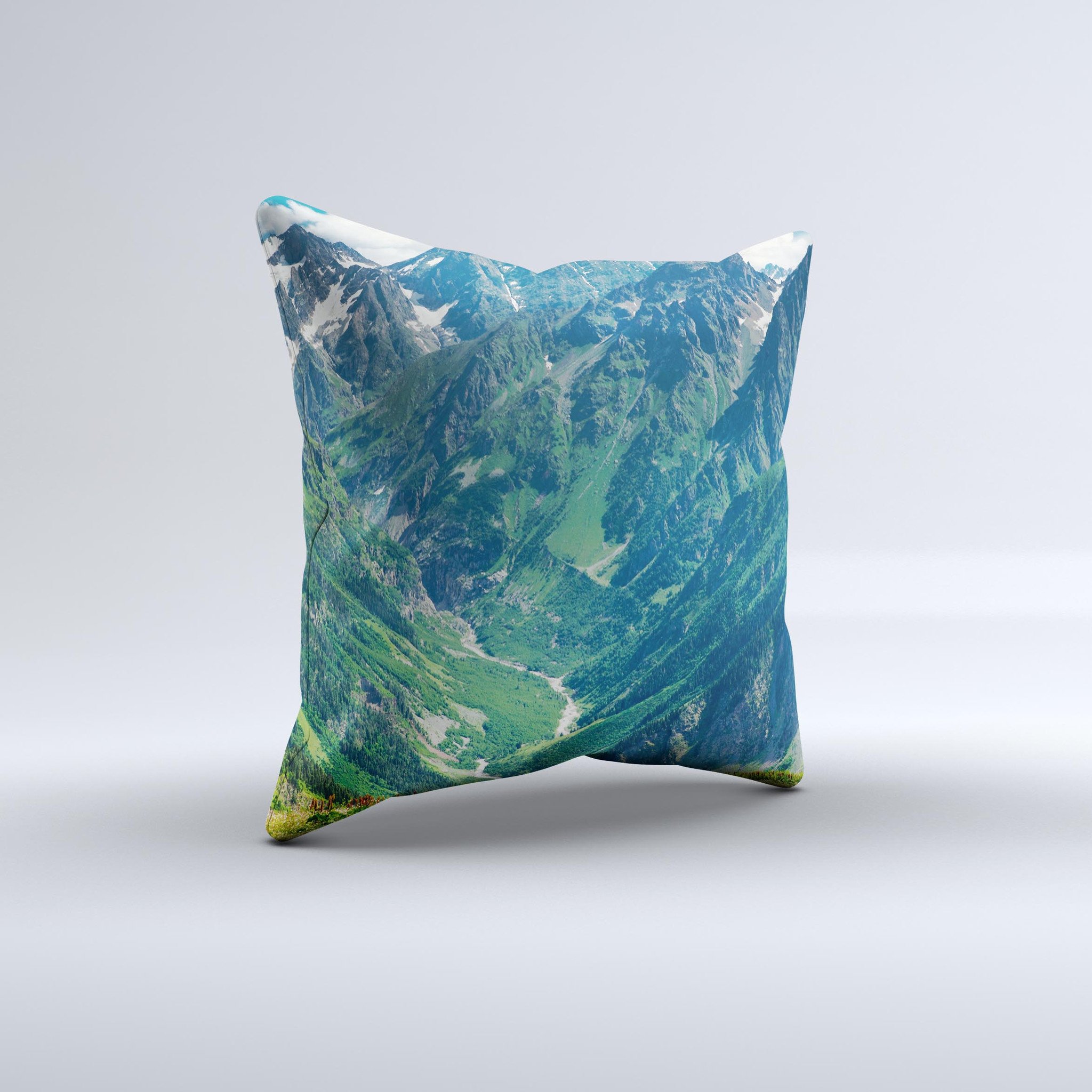 A beautifully crafted Scenic Mountaintops ink-Fuzed Decorative Throw Pillow showcasing a serene mountain landscape design, perfect for home decor.