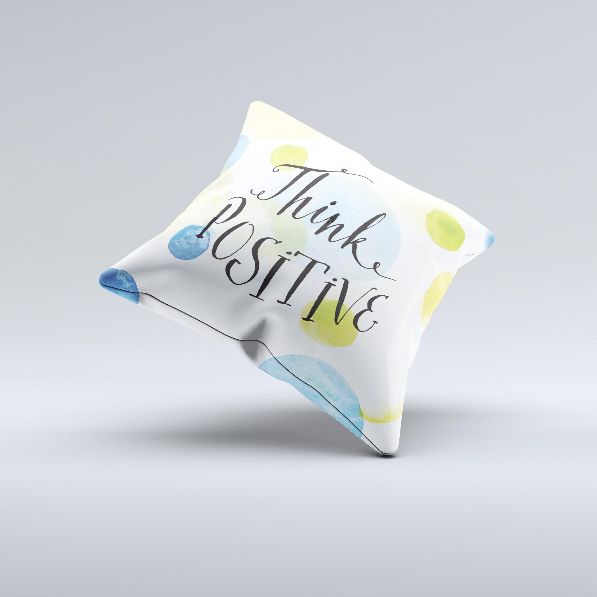 A handcrafted decorative throw pillow with a positive message, featuring high thread count fabric and unique design imperfections.