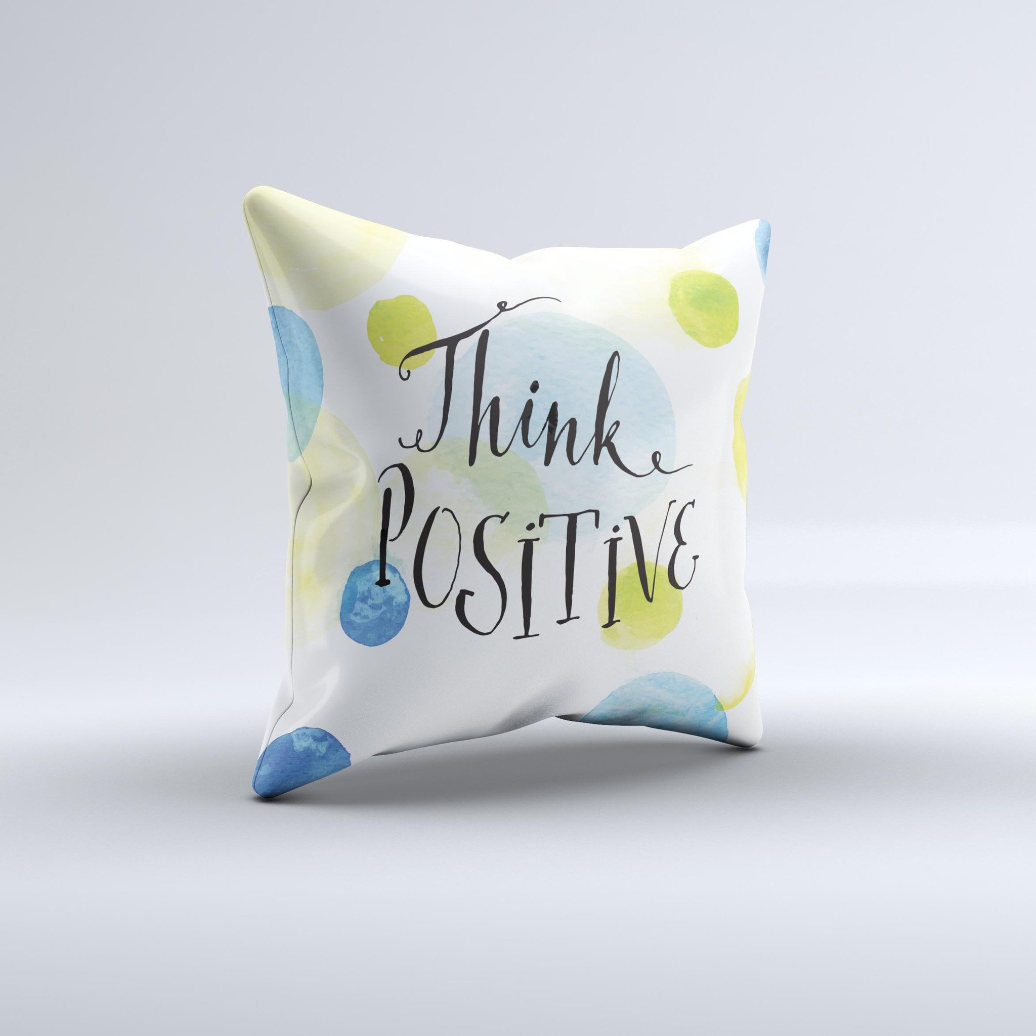 A handcrafted decorative throw pillow with a positive message, featuring high thread count fabric and unique design imperfections.