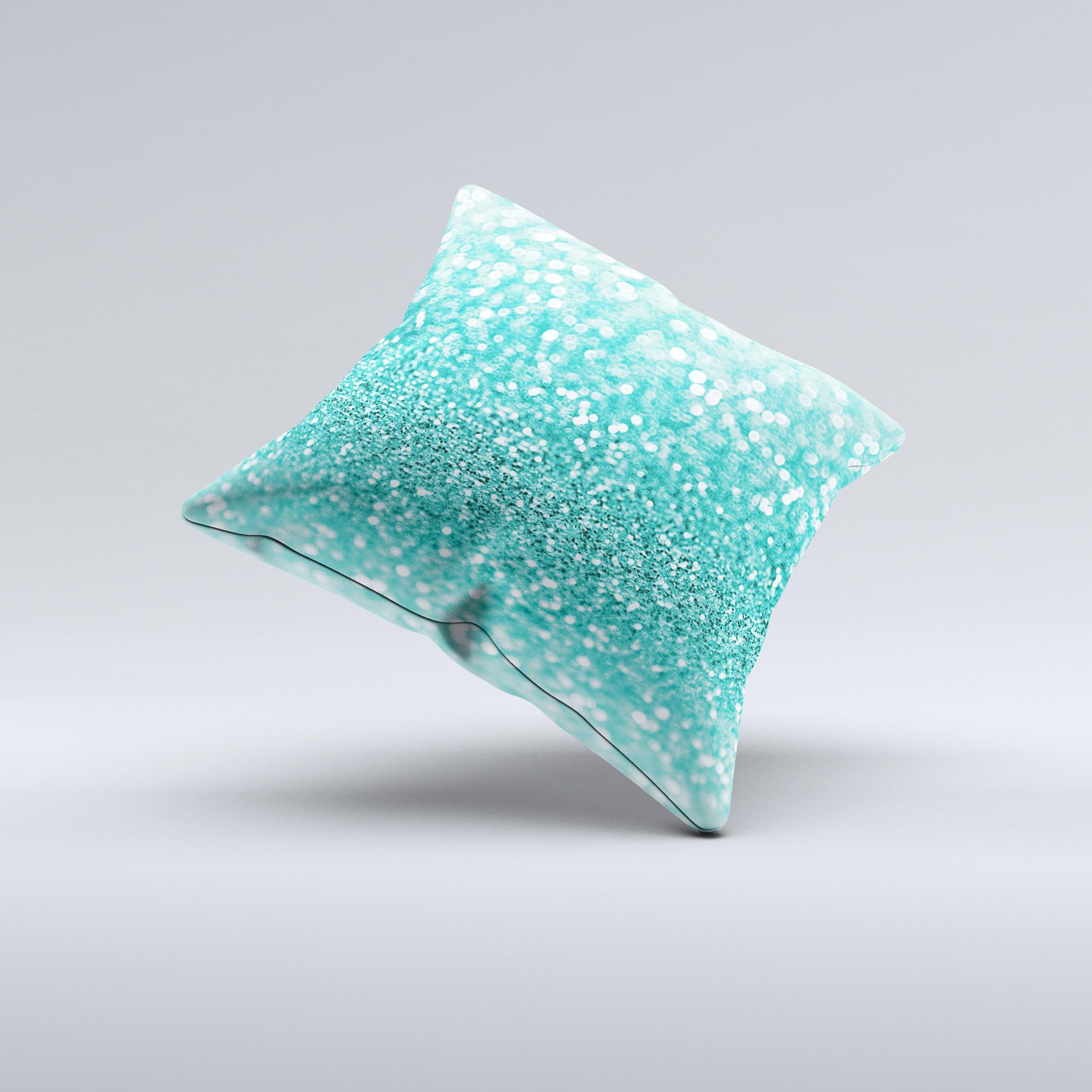 Turquoise decorative throw pillow with glimmering design, handcrafted in Virginia, showcasing unique imperfections.