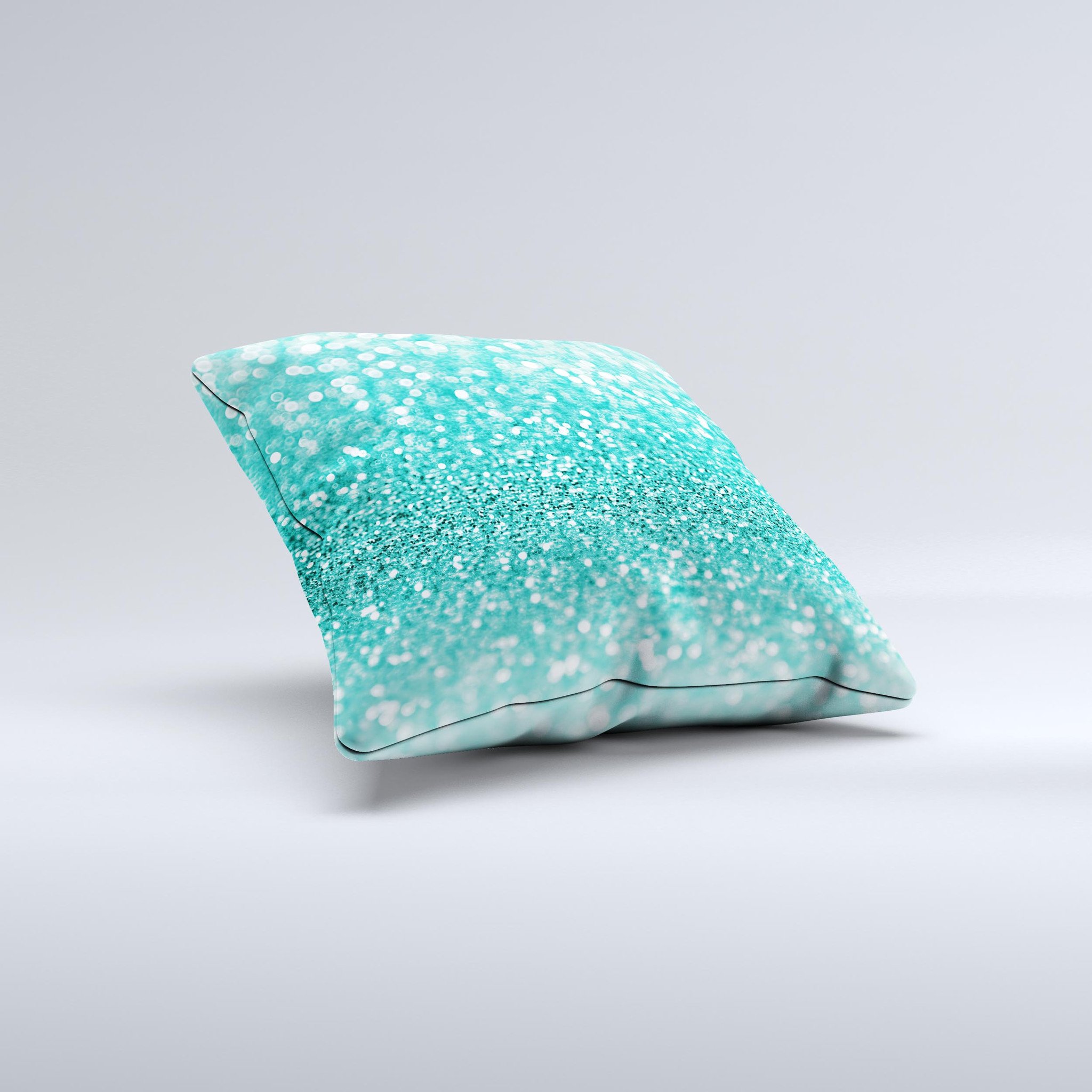 Turquoise decorative throw pillow with glimmering design, handcrafted in Virginia, showcasing unique imperfections.