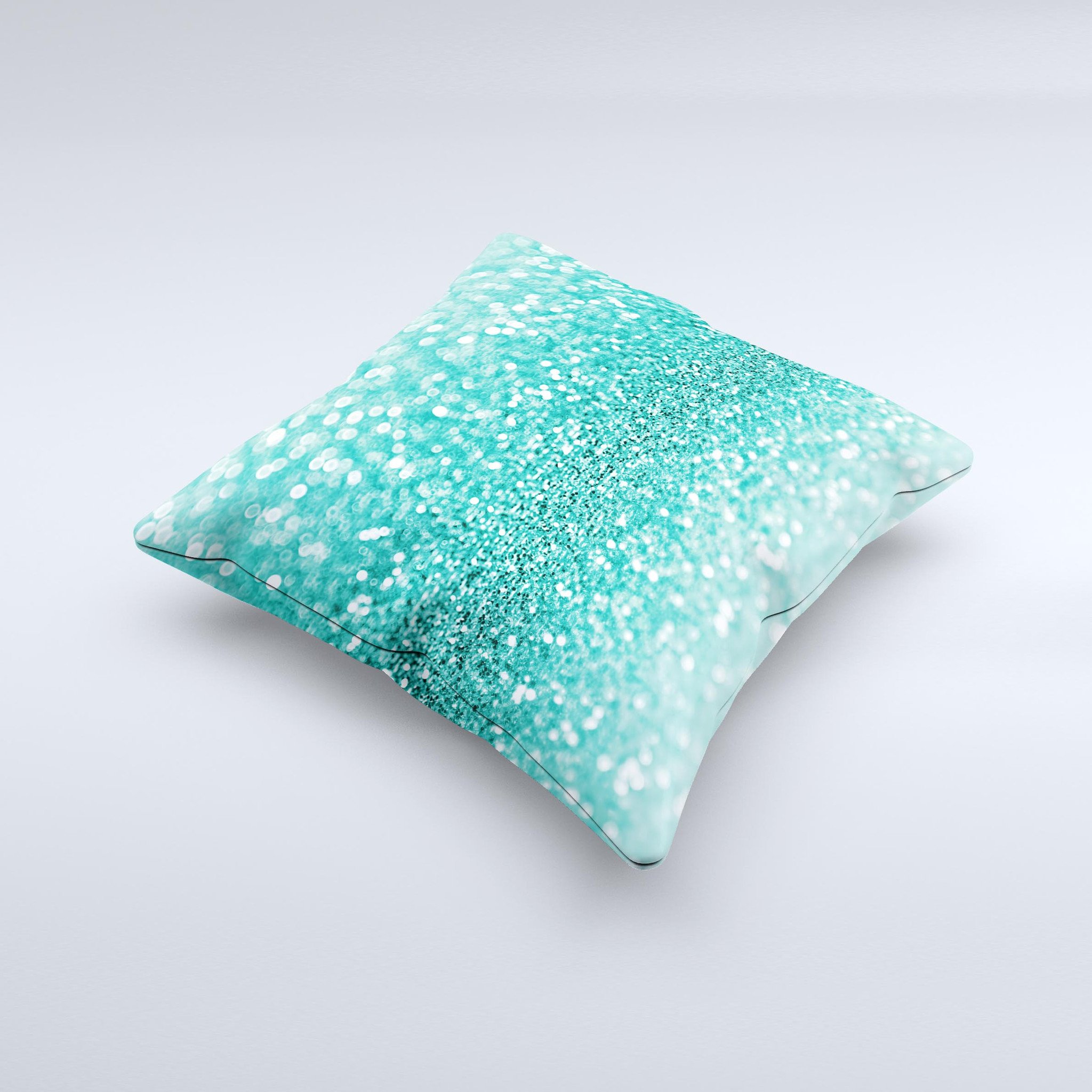 Turquoise decorative throw pillow with glimmering design, handcrafted in Virginia, showcasing unique imperfections.