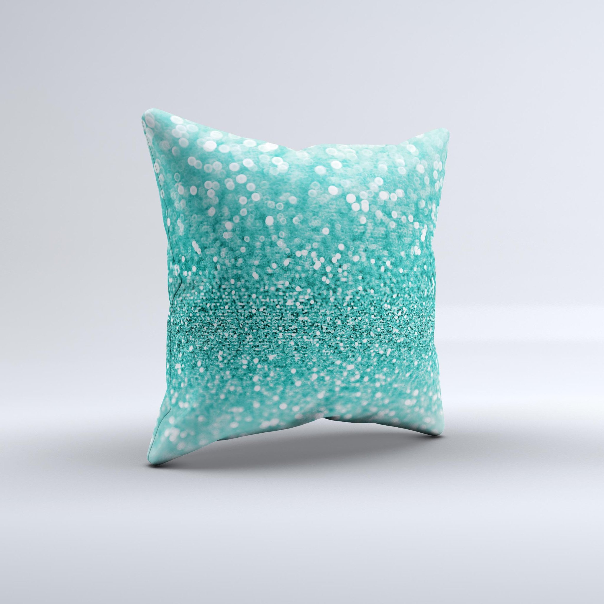 Turquoise decorative throw pillow with glimmering design, handcrafted in Virginia, showcasing unique imperfections.