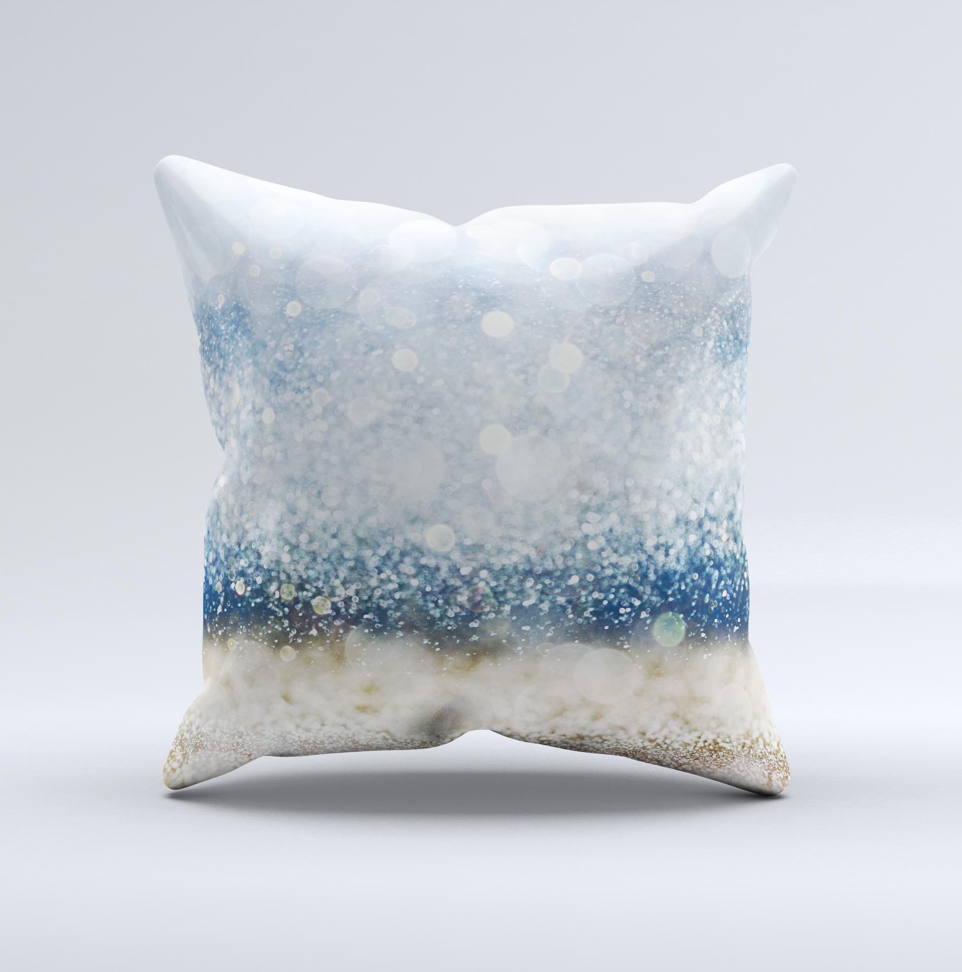 A decorative throw pillow featuring unfocused blue and gold sparkles, showcasing a unique handmade design with a high thread count fabric.