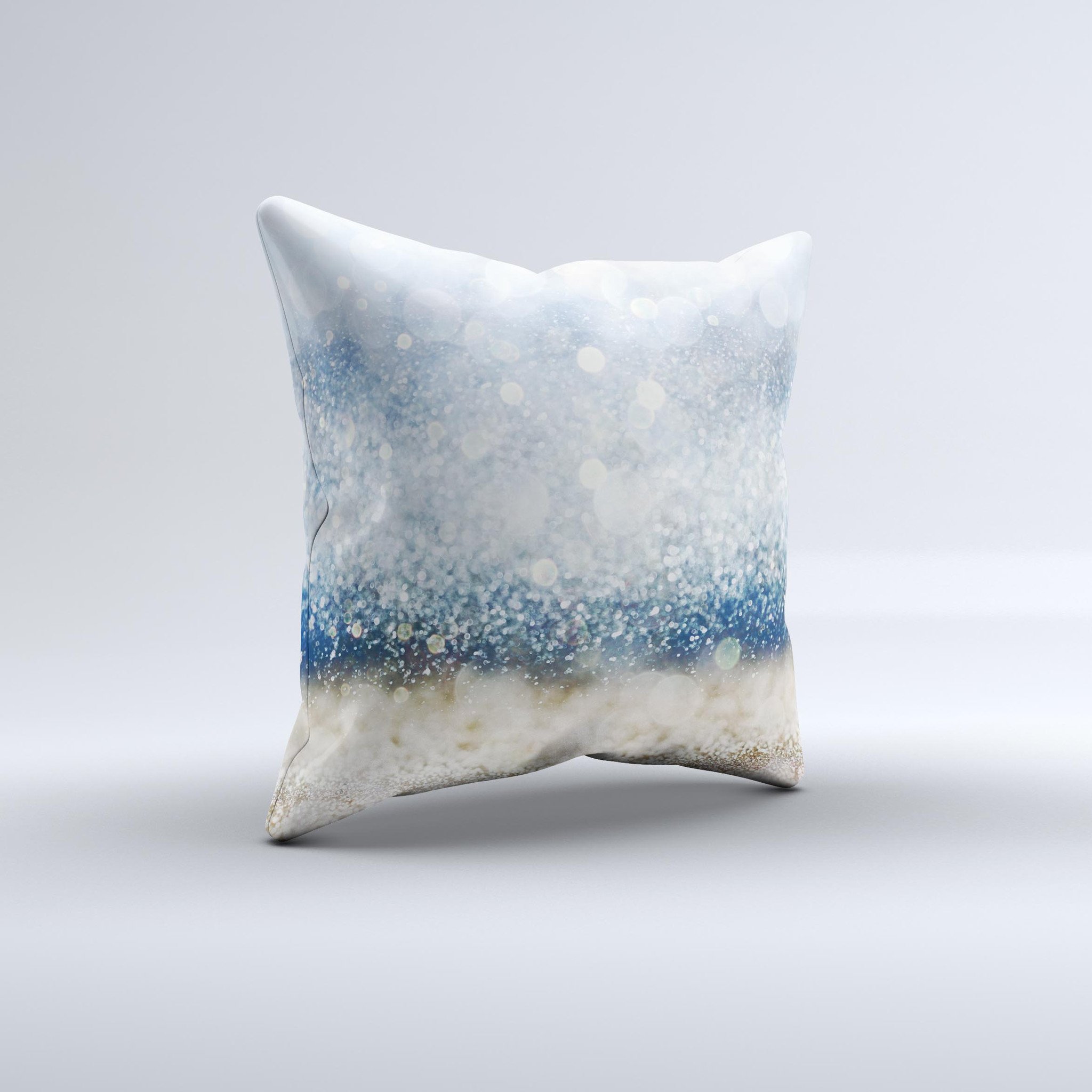 A decorative throw pillow featuring unfocused blue and gold sparkles, showcasing a unique handmade design with a high thread count fabric.