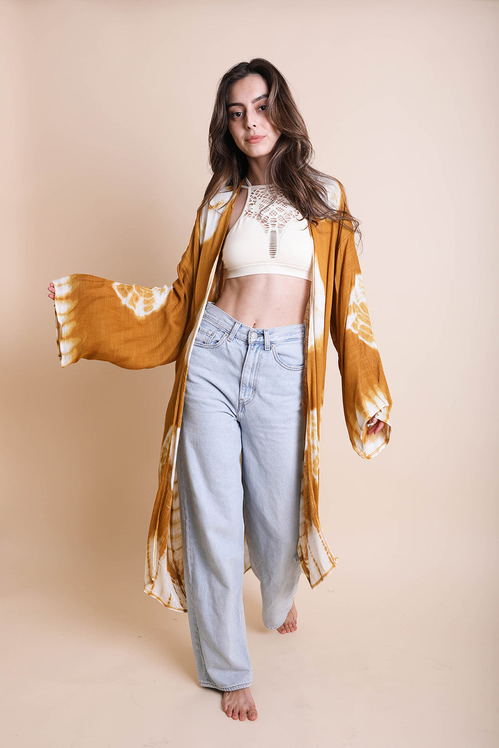 A vibrant Tie Dye Kimono featuring a colorful pattern, perfect for spring and summer wear, made from lightweight polyester fabric.