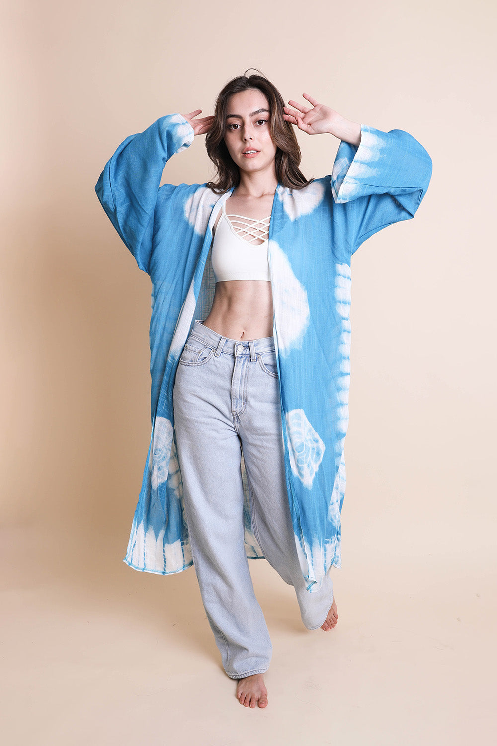 A vibrant Tie Dye Kimono featuring a colorful pattern, perfect for spring and summer wear, made from lightweight polyester fabric.