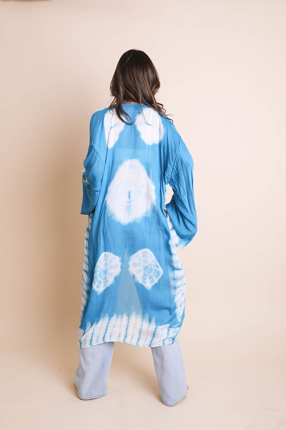 A vibrant Tie Dye Kimono featuring a colorful pattern, perfect for spring and summer wear, made from lightweight polyester fabric.