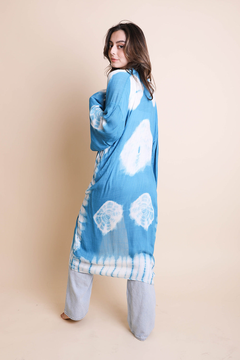 A vibrant Tie Dye Kimono featuring a colorful pattern, perfect for spring and summer wear, made from lightweight polyester fabric.