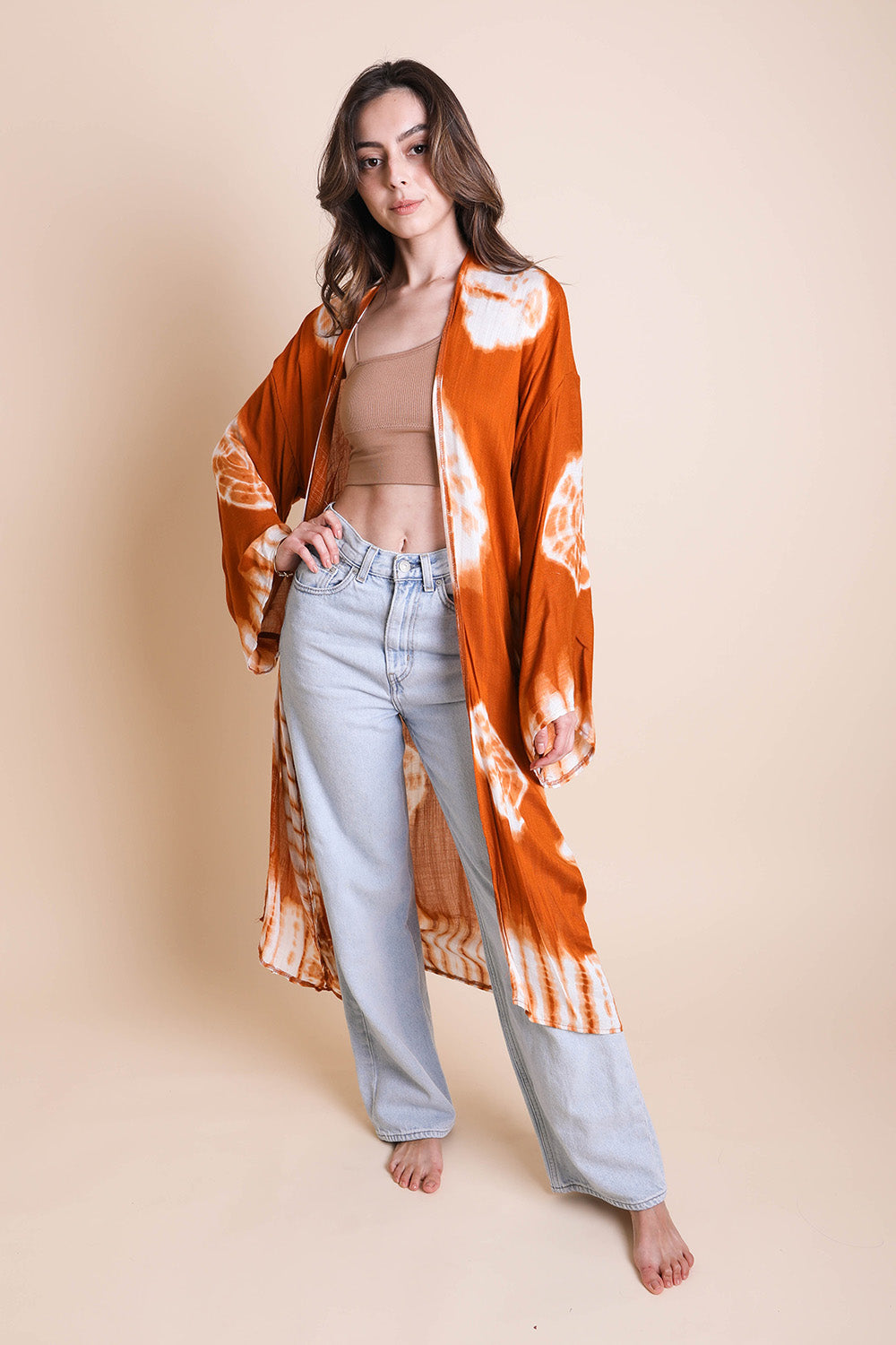 A vibrant Tie Dye Kimono featuring a colorful pattern, perfect for spring and summer wear, made from lightweight polyester fabric.