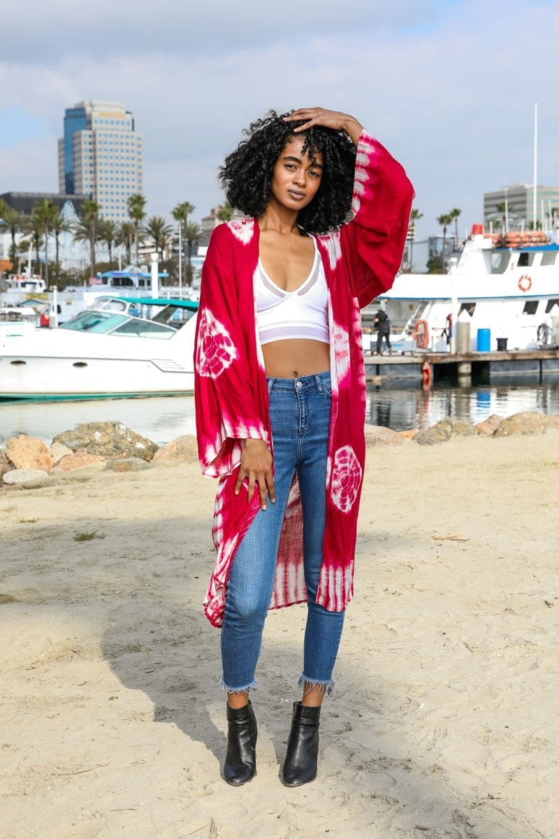 A vibrant Tie Dye Kimono featuring a colorful pattern, perfect for spring and summer wear, made from lightweight polyester fabric.