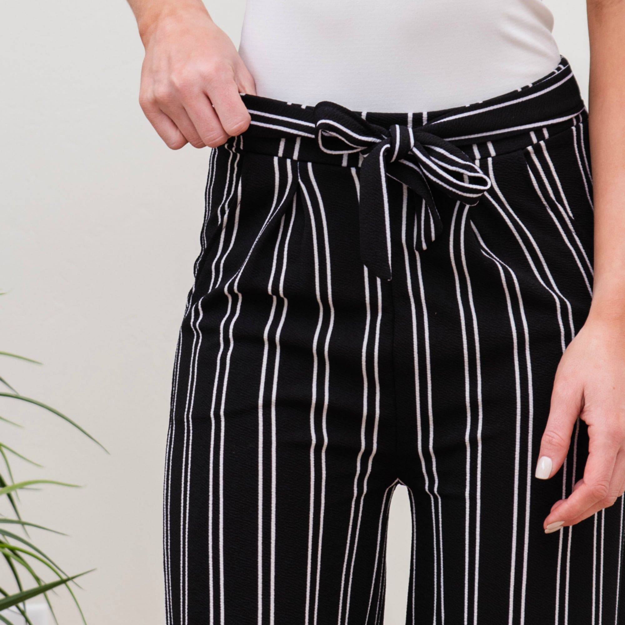 A stylish pair of Tie Waist Dress Pants featuring a comfortable elastic waistband and adjustable tie waist, perfect for professional settings.