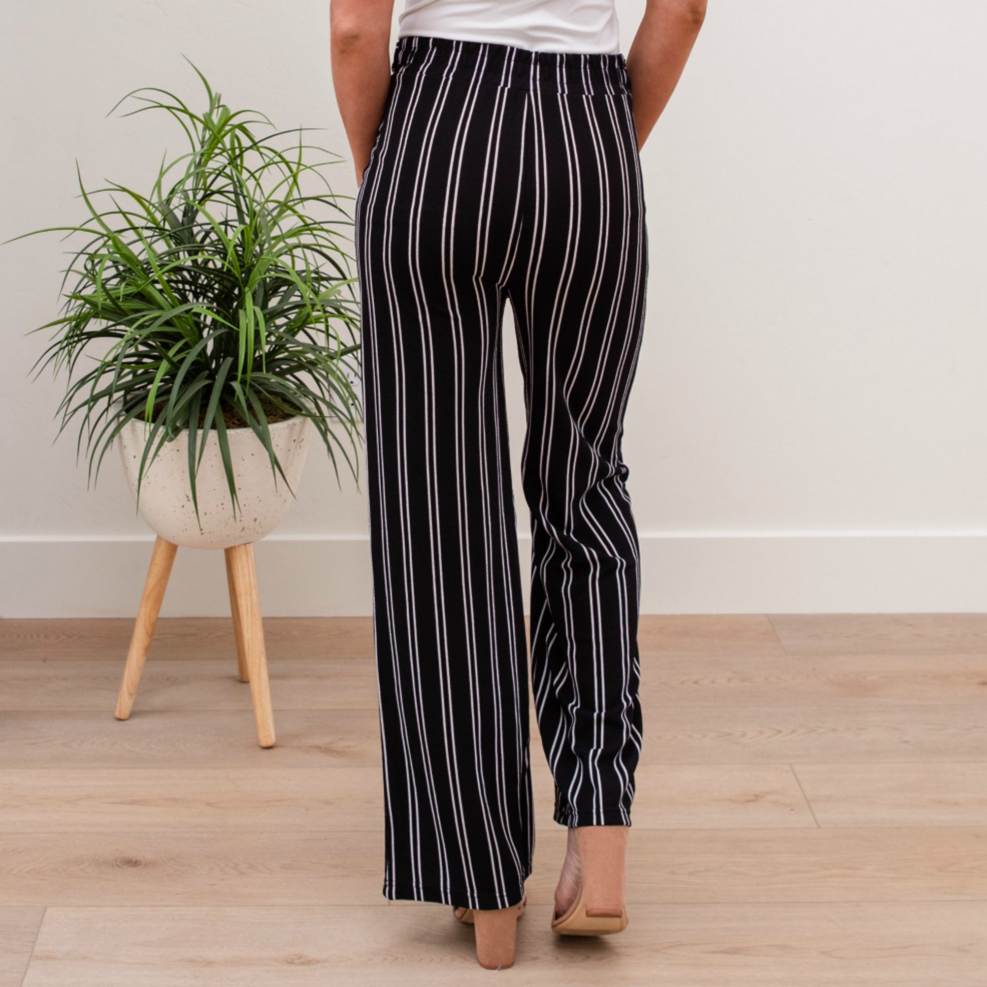 A stylish pair of Tie Waist Dress Pants featuring a comfortable elastic waistband and adjustable tie waist, perfect for professional settings.