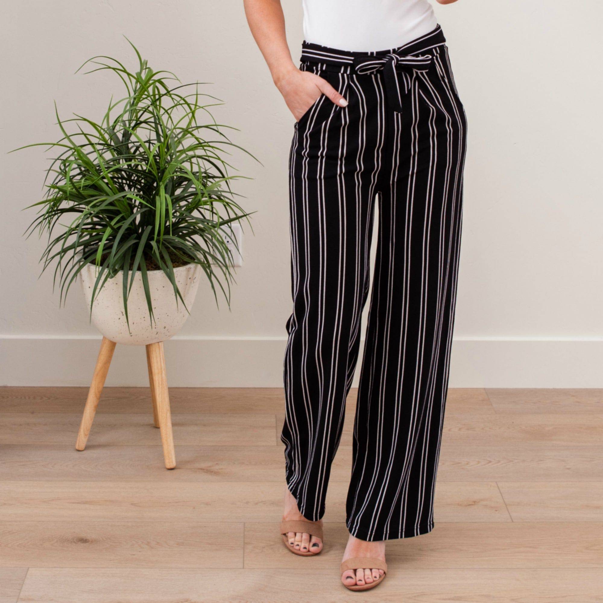 A stylish pair of Tie Waist Dress Pants featuring a comfortable elastic waistband and adjustable tie waist, perfect for professional settings.