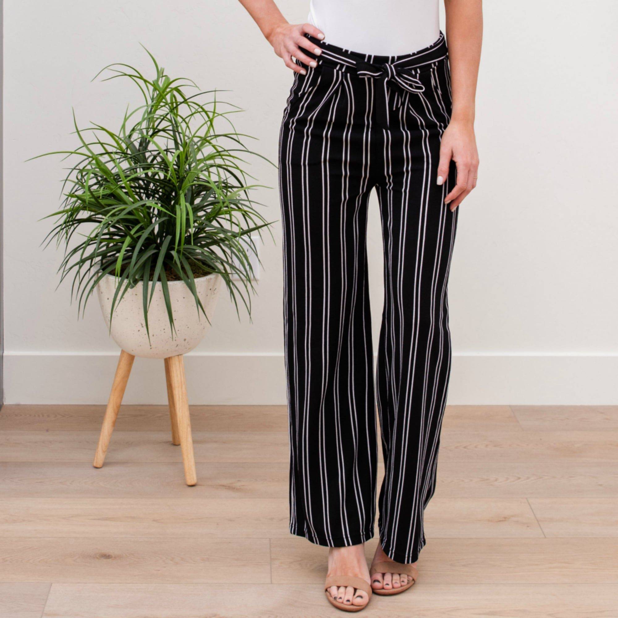 A stylish pair of Tie Waist Dress Pants featuring a comfortable elastic waistband and adjustable tie waist, perfect for professional settings.