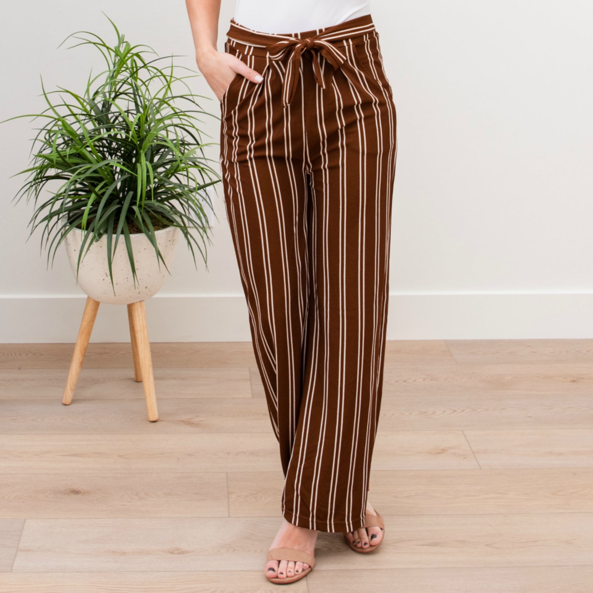 A stylish pair of Tie Waist Dress Pants featuring a comfortable elastic waistband and adjustable tie waist, perfect for professional settings.