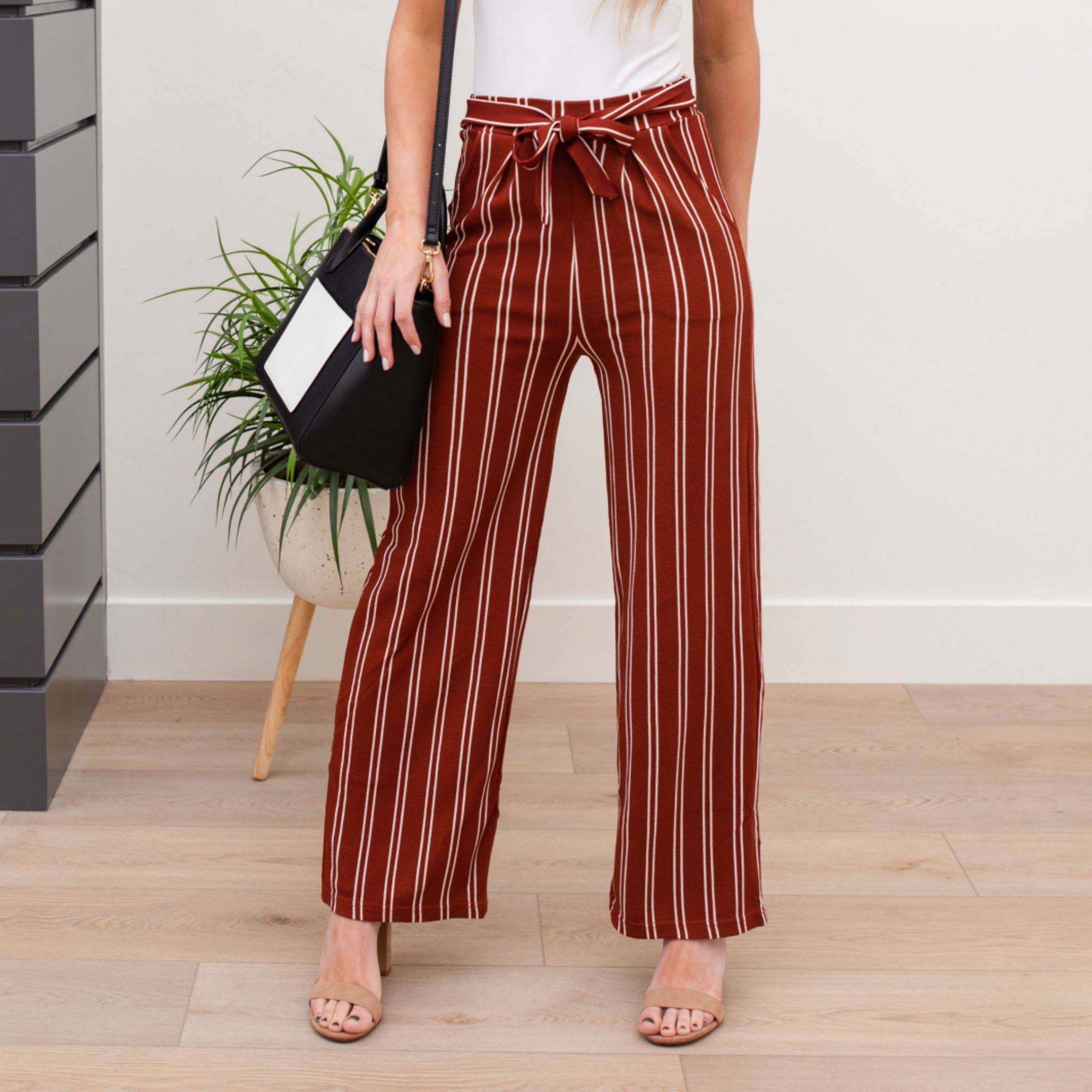 A stylish pair of Tie Waist Dress Pants featuring a comfortable elastic waistband and adjustable tie waist, perfect for professional settings.