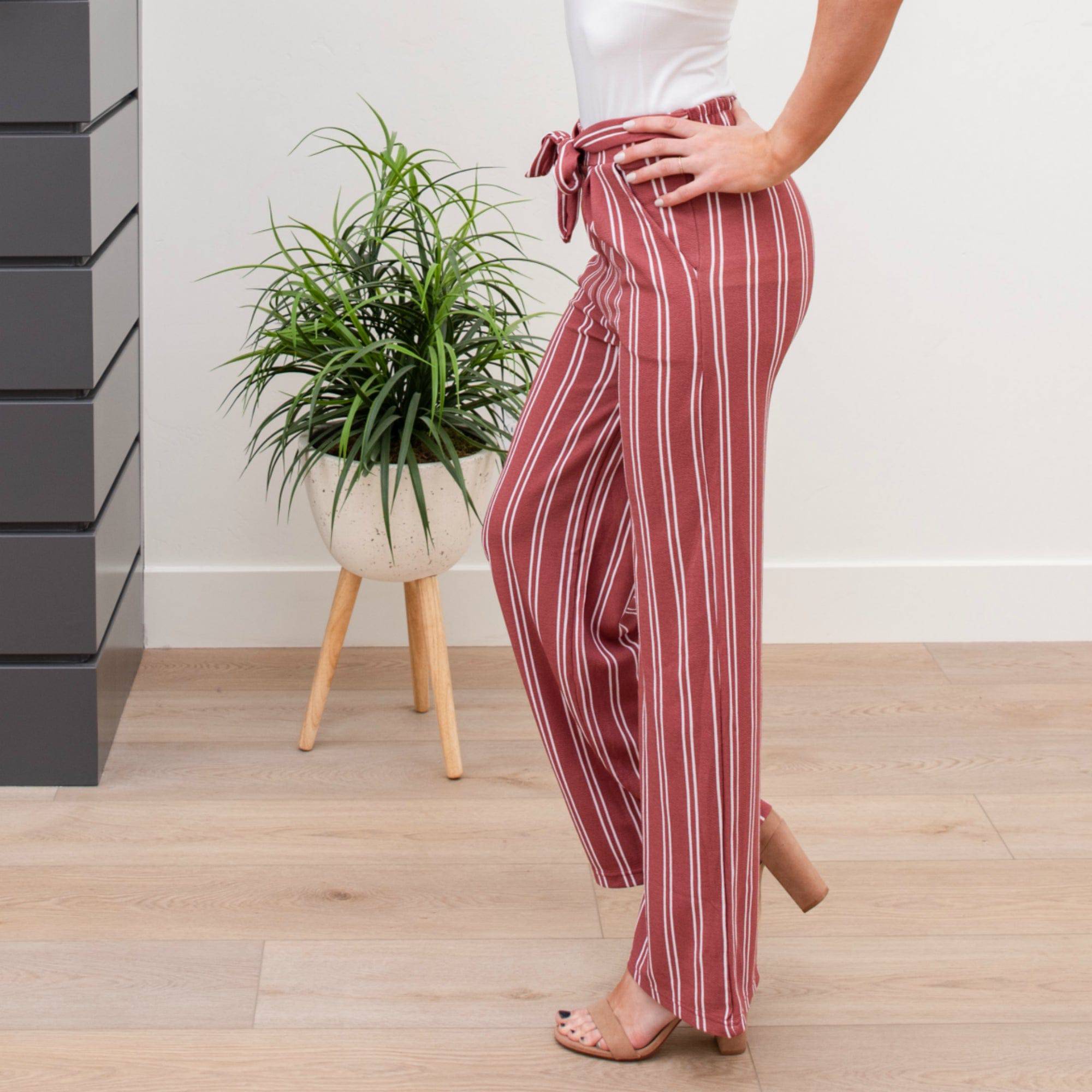 A stylish pair of Tie Waist Dress Pants featuring a comfortable elastic waistband and adjustable tie waist, perfect for professional settings.