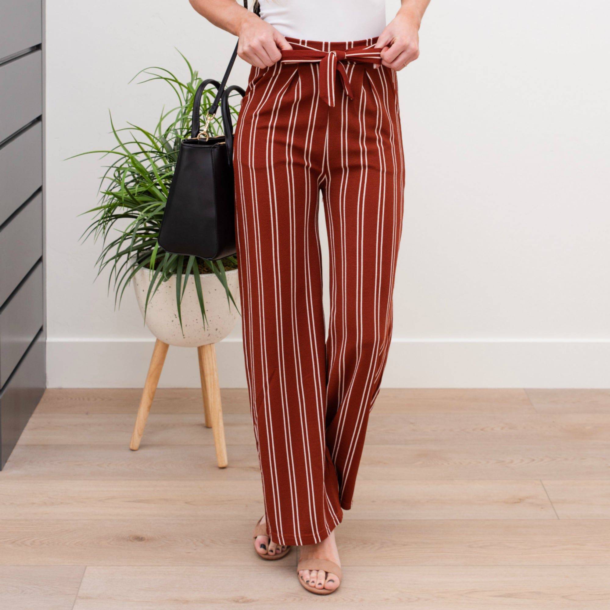 A stylish pair of Tie Waist Dress Pants featuring a comfortable elastic waistband and adjustable tie waist, perfect for professional settings.