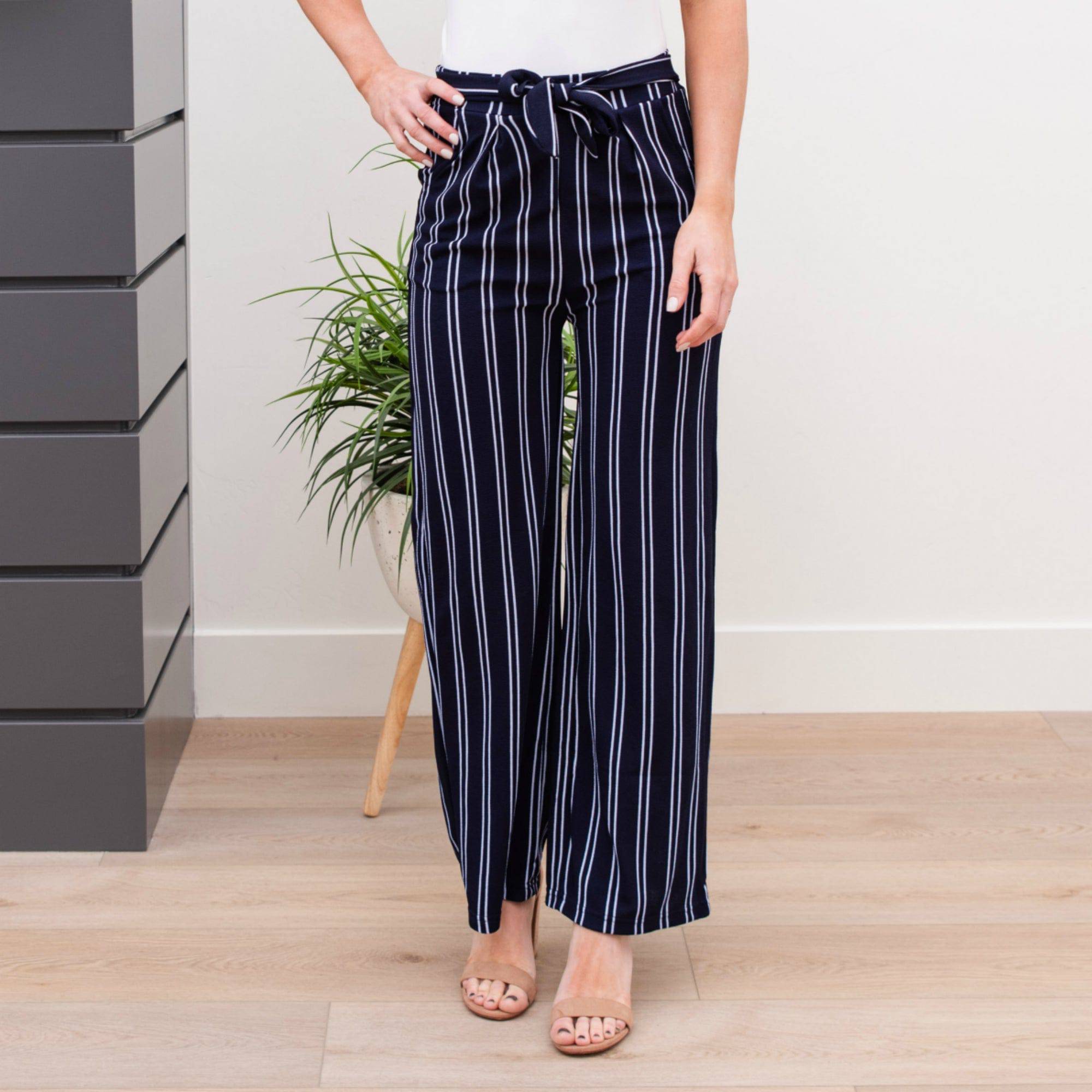 A stylish pair of Tie Waist Dress Pants featuring a comfortable elastic waistband and adjustable tie waist, perfect for professional settings.