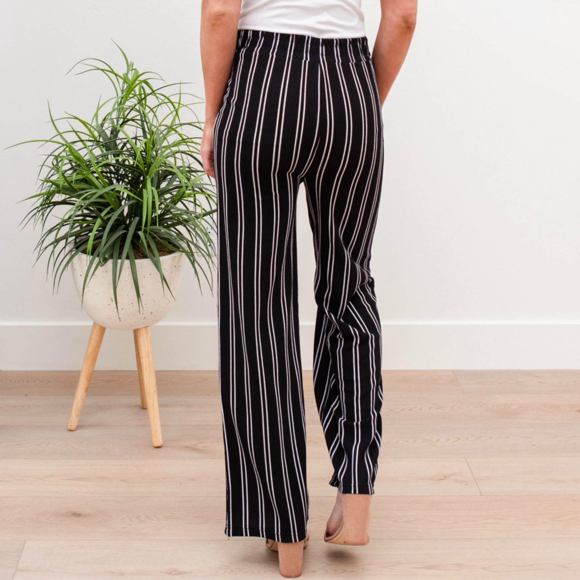 A stylish pair of Tie Waist Dress Pants featuring a comfortable elastic waistband and adjustable tie waist, perfect for professional settings.