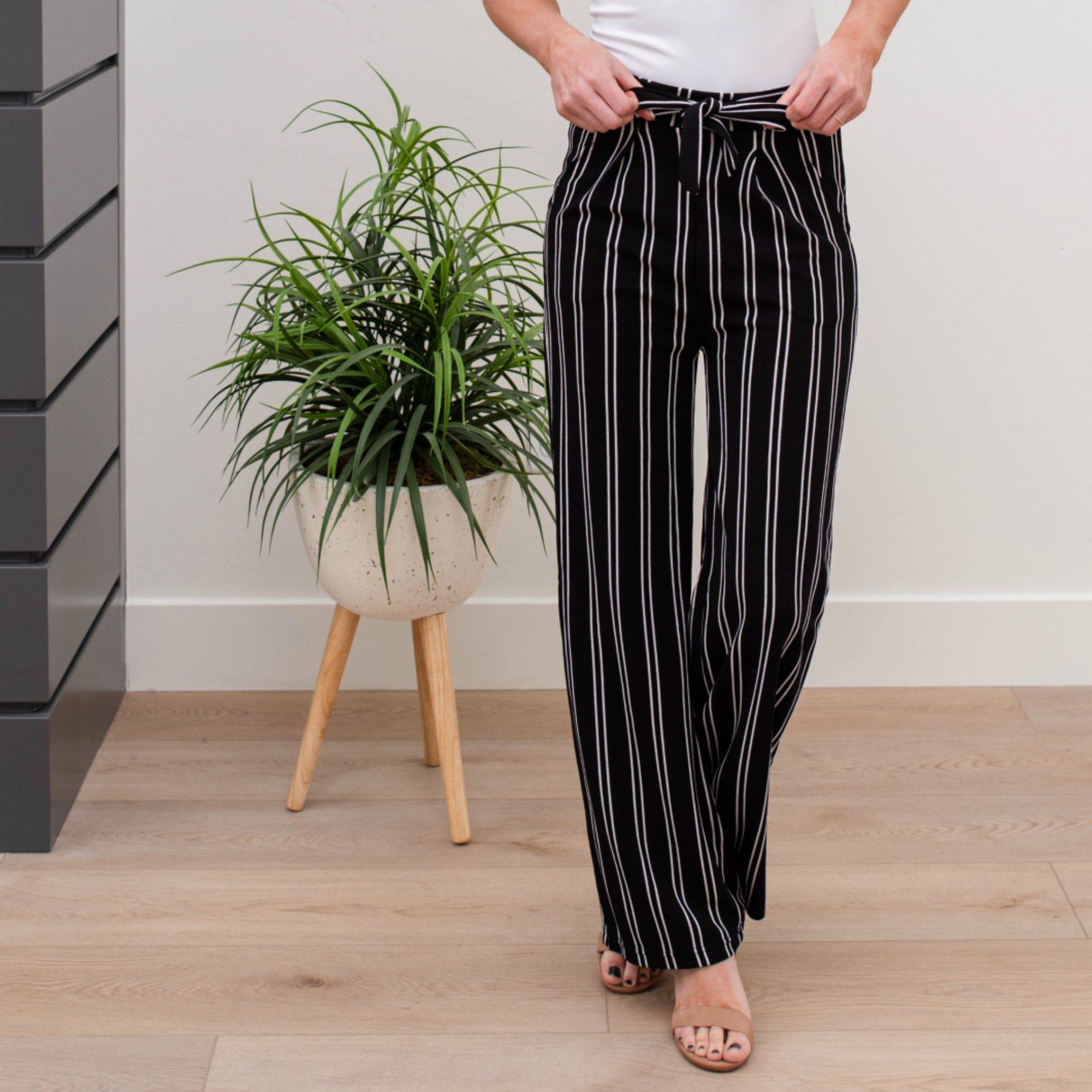 A stylish pair of Tie Waist Dress Pants featuring a comfortable elastic waistband and adjustable tie waist, perfect for professional settings.