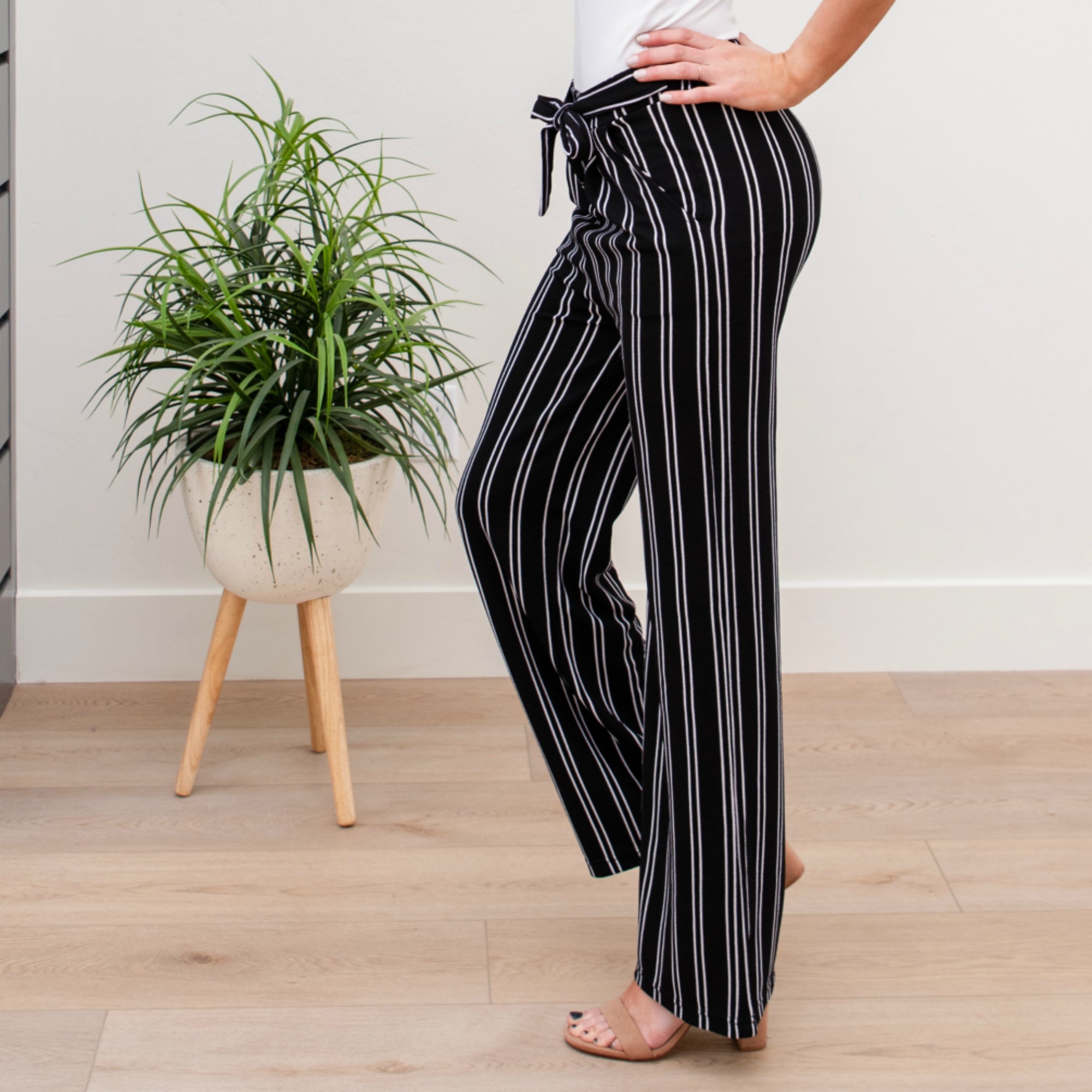 A stylish pair of Tie Waist Dress Pants featuring a comfortable elastic waistband and adjustable tie waist, perfect for professional settings.