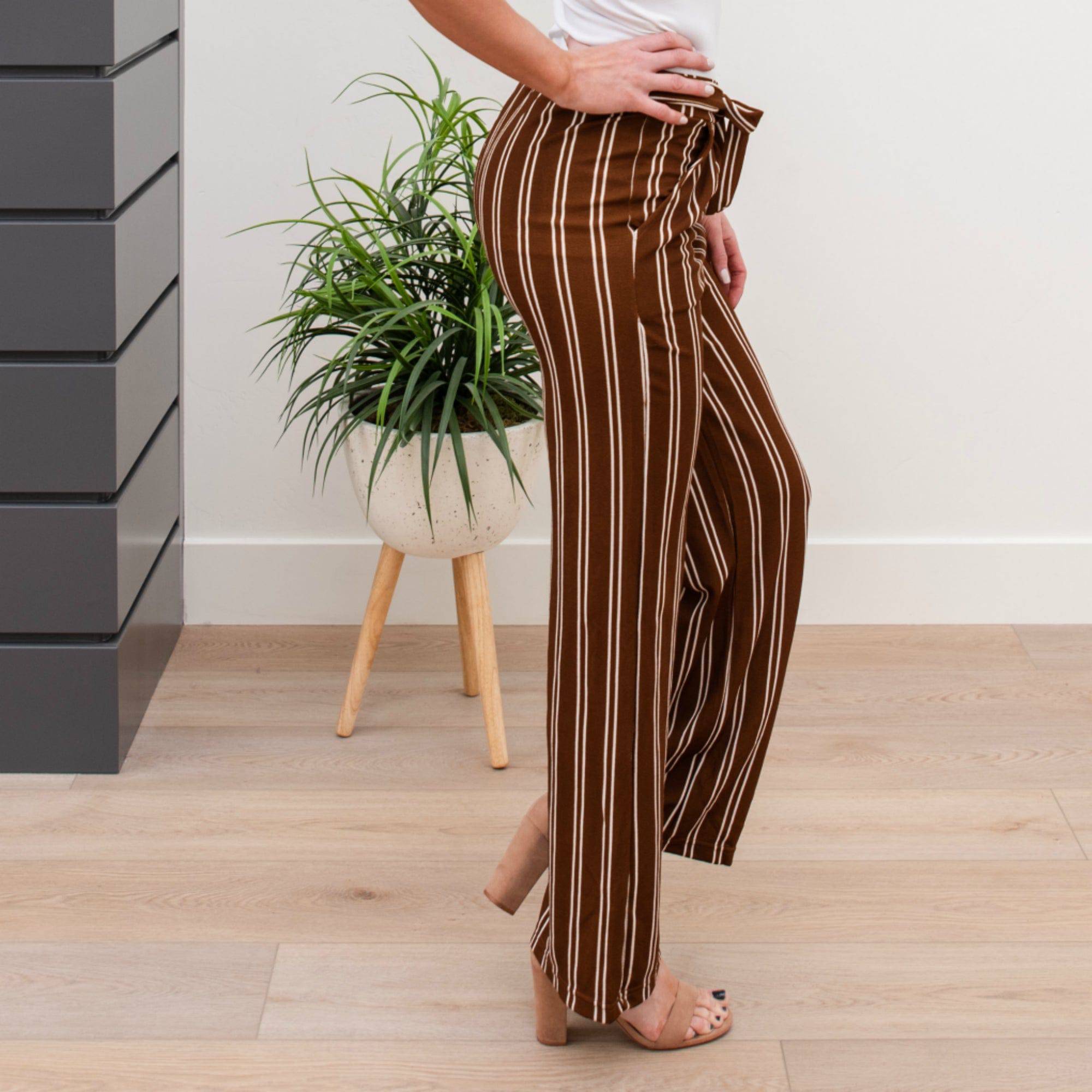 A stylish pair of Tie Waist Dress Pants featuring a comfortable elastic waistband and adjustable tie waist, perfect for professional settings.