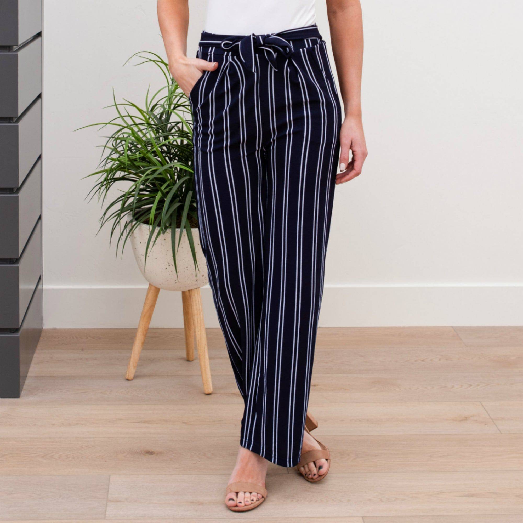 A stylish pair of Tie Waist Dress Pants featuring a comfortable elastic waistband and adjustable tie waist, perfect for professional settings.