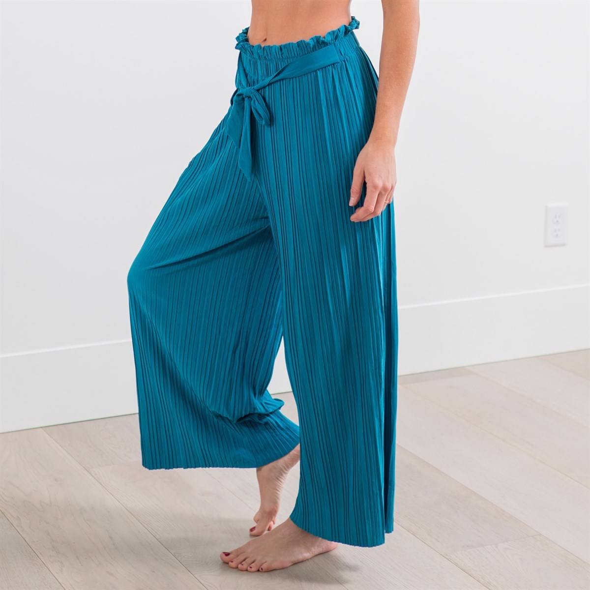 A pair of stylish Tie Waist Palazzo Pants in a vibrant color, showcasing a lightweight fabric and a comfortable fit, perfect for beach or casual outings.