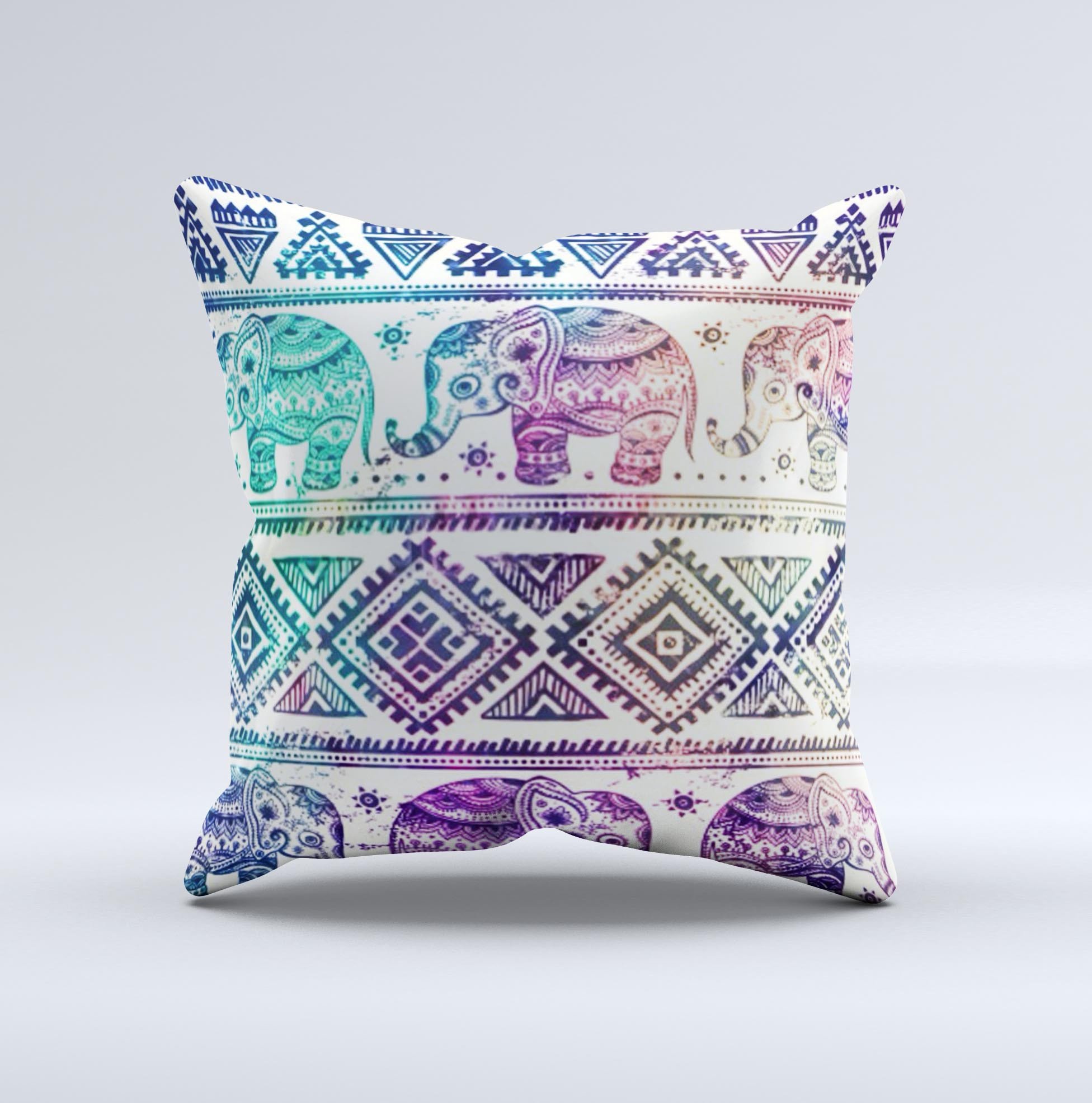 A vibrant tie-dyed decorative throw pillow featuring an intricate Aztec elephant pattern, handcrafted in Virginia.