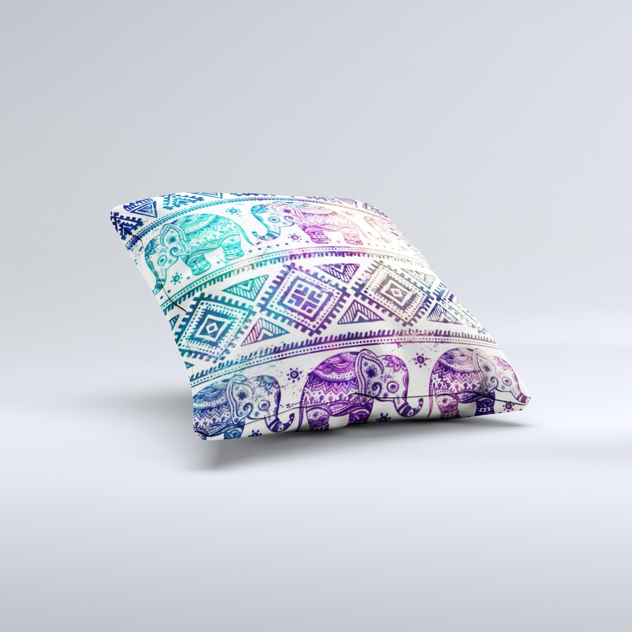 A vibrant tie-dyed decorative throw pillow featuring an intricate Aztec elephant pattern, handcrafted in Virginia.