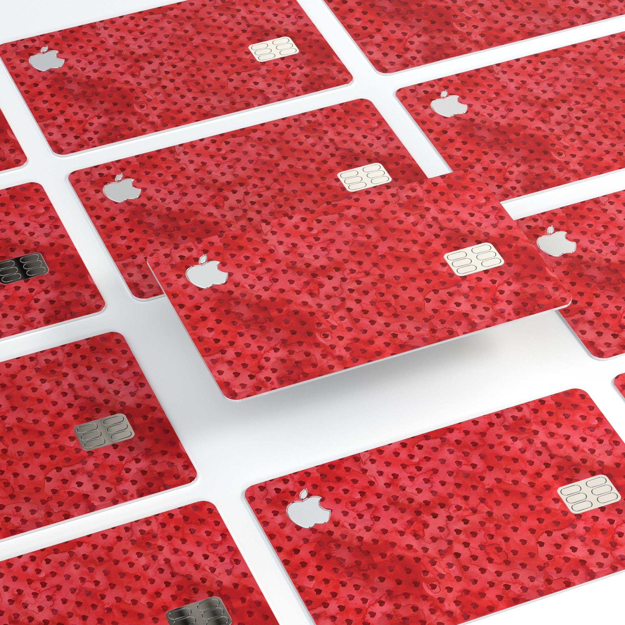 Tiny Red Watercolor Hearts decal skin for Apple Card, showcasing vibrant heart designs on a protective vinyl layer.