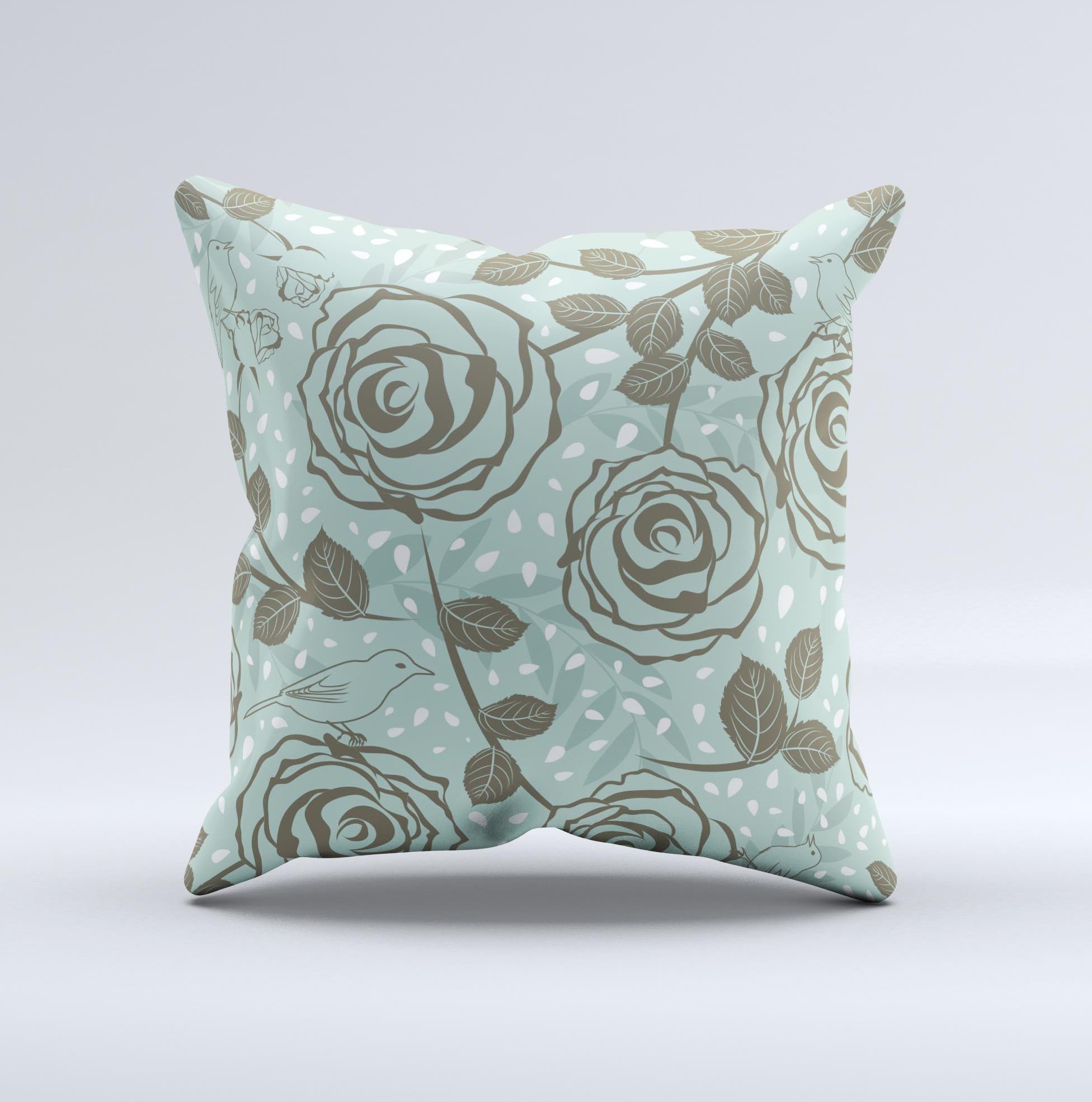 Toned green decorative throw pillow featuring vector roses and birds, showcasing a unique handmade design.