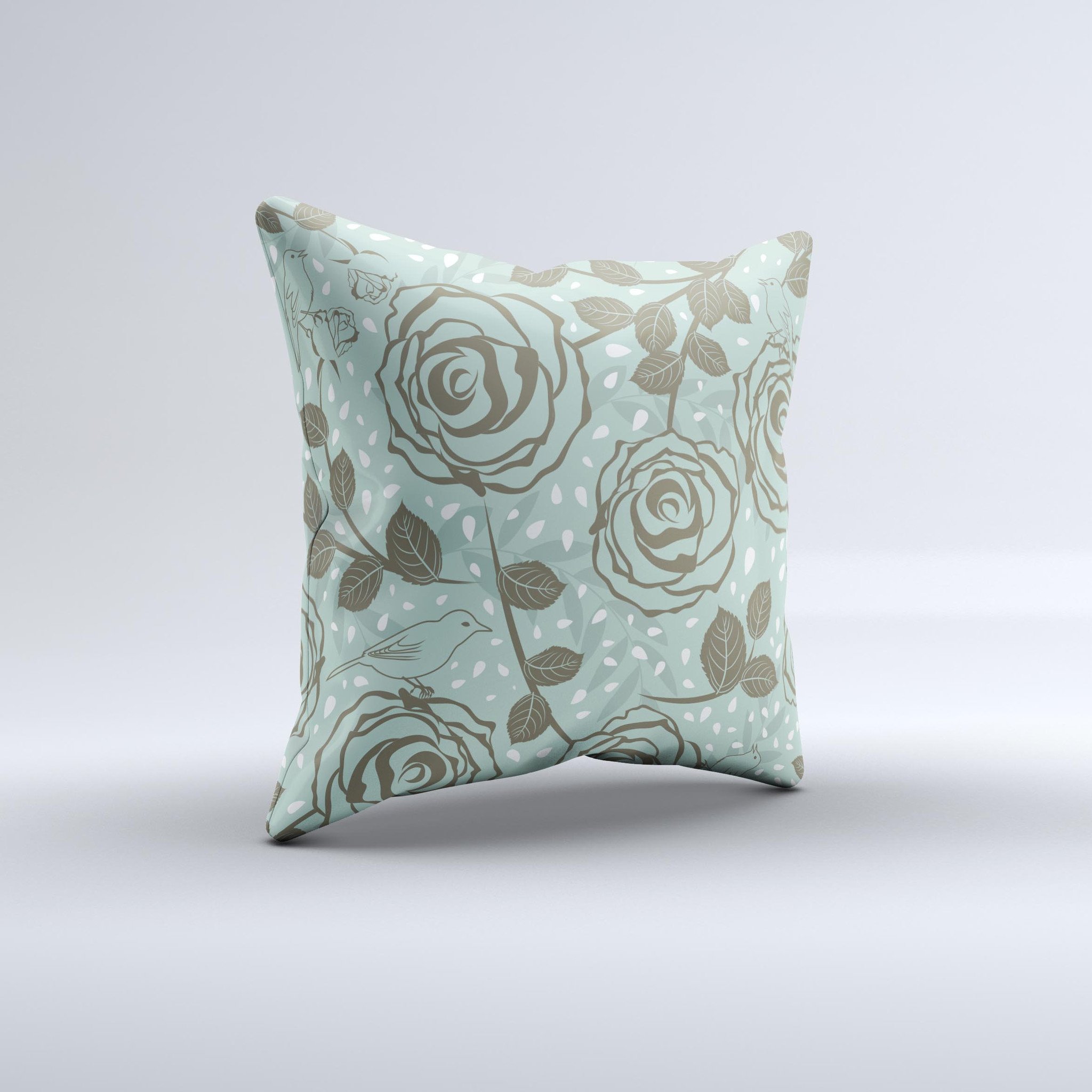 Toned green decorative throw pillow featuring vector roses and birds, showcasing a unique handmade design.