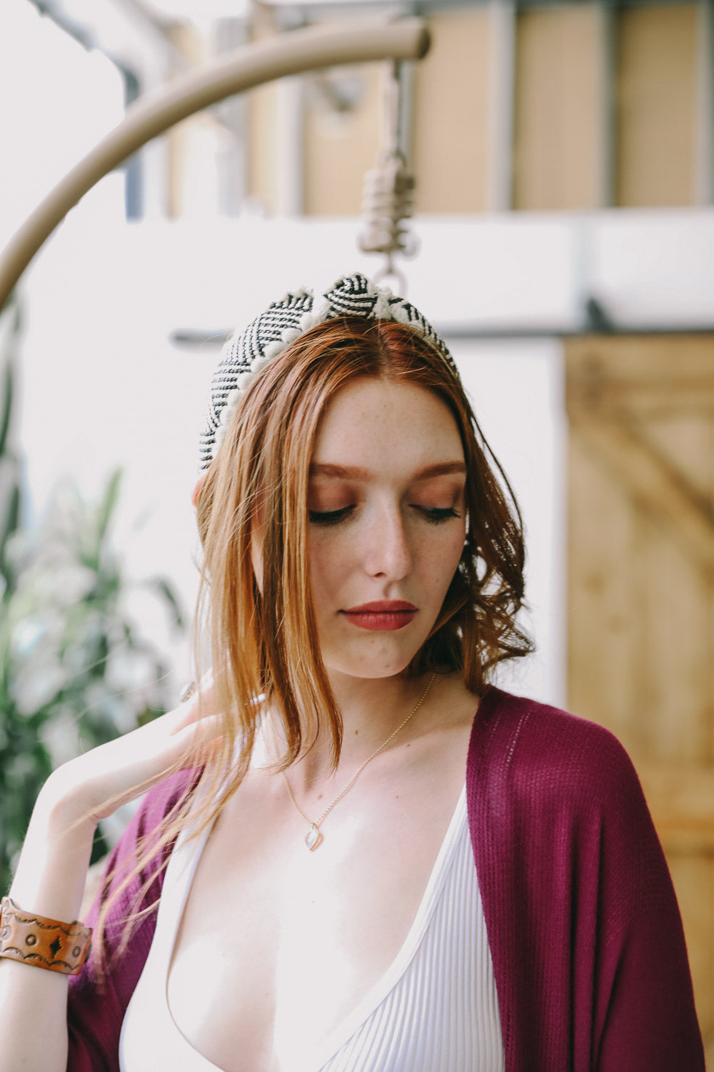 Top Knot Checker Crochet Headband featuring a trendy checker print design, perfect for stylish outfits.