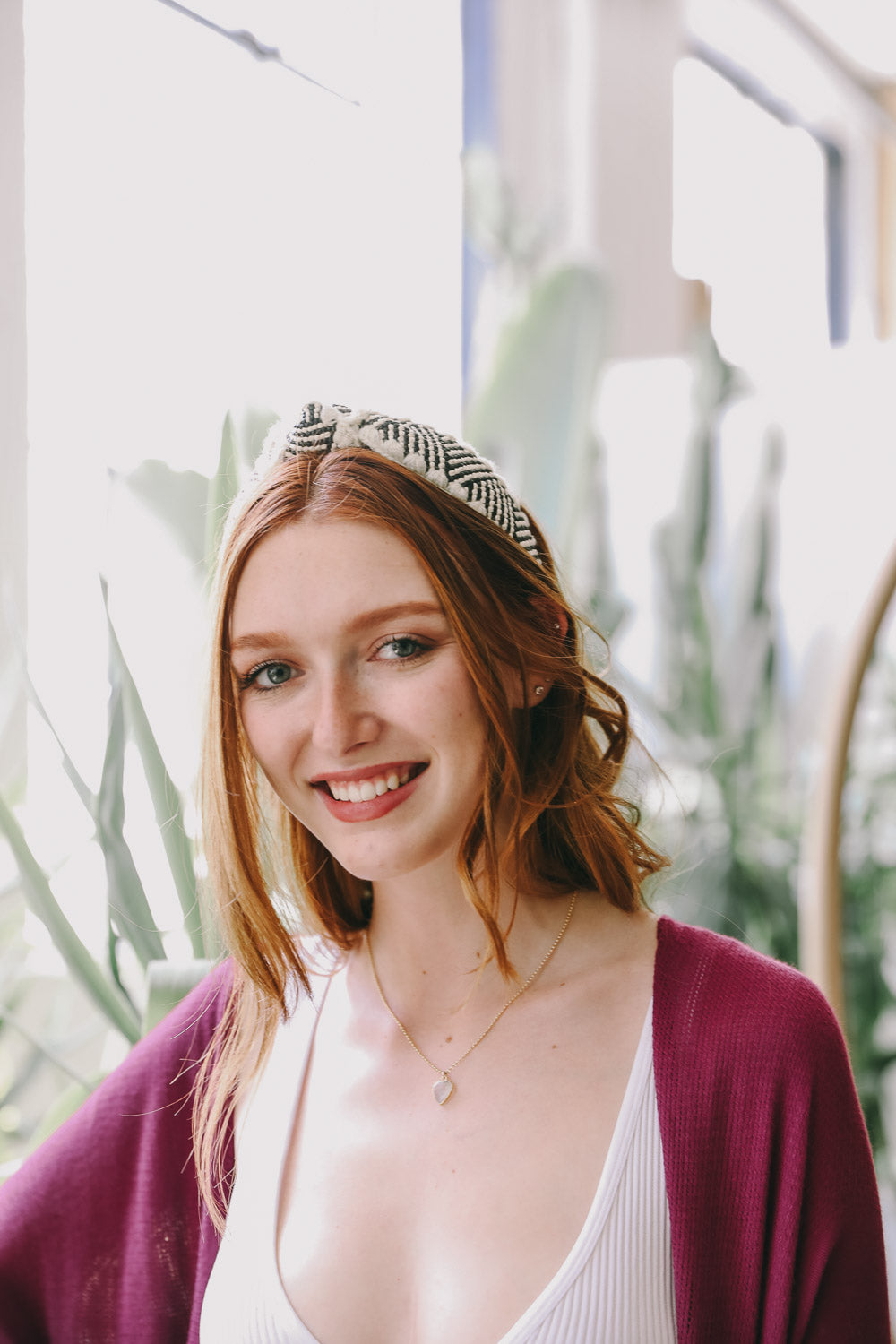 Top Knot Checker Crochet Headband featuring a trendy checker print design, perfect for stylish outfits.