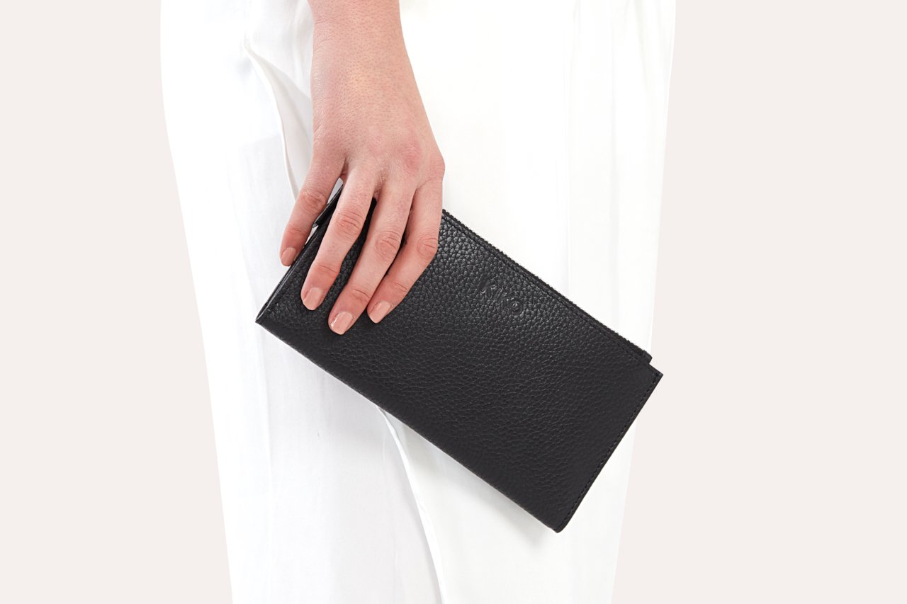 Top Zip Wallet made of genuine pebble leather with multiple card slots and a zip coin pouch.