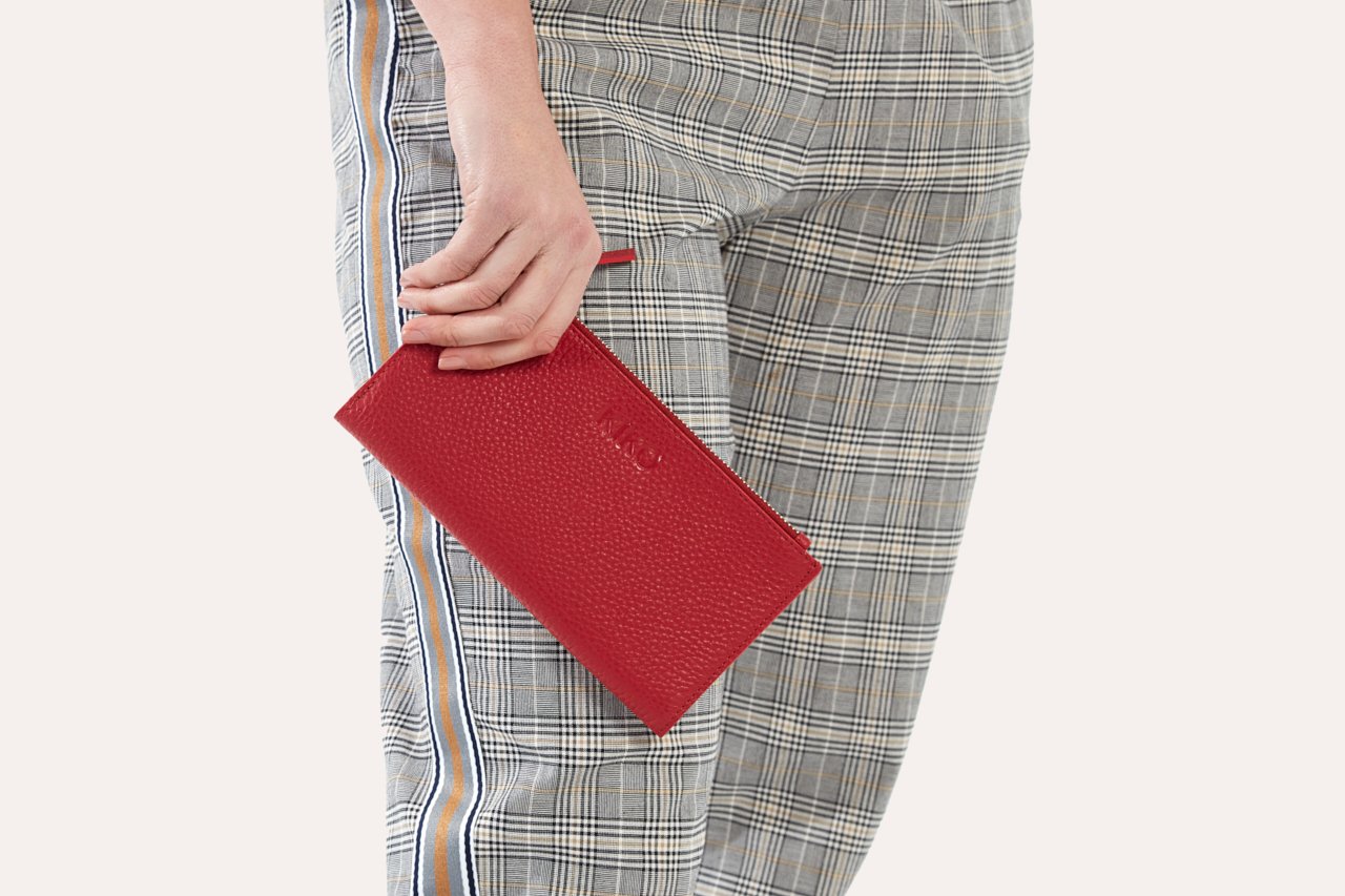 Top Zip Wallet made of genuine pebble leather with multiple card slots and a zip coin pouch.