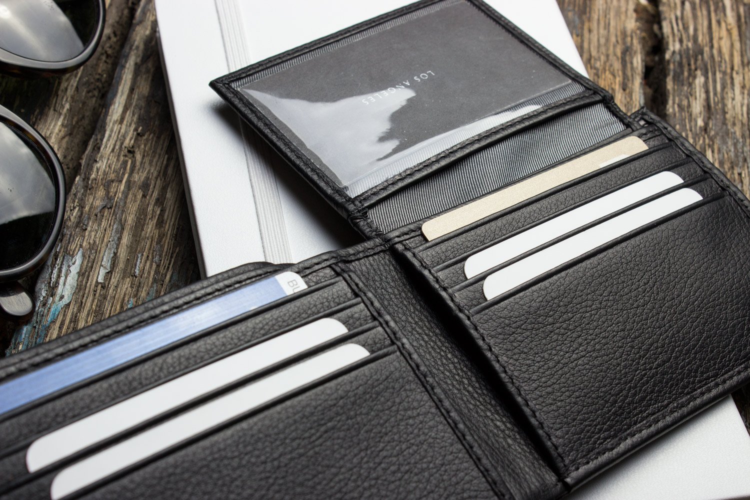 Traditional Bifold Wallet made of glove tanned cowhide leather with removable ID window and multiple card slots.