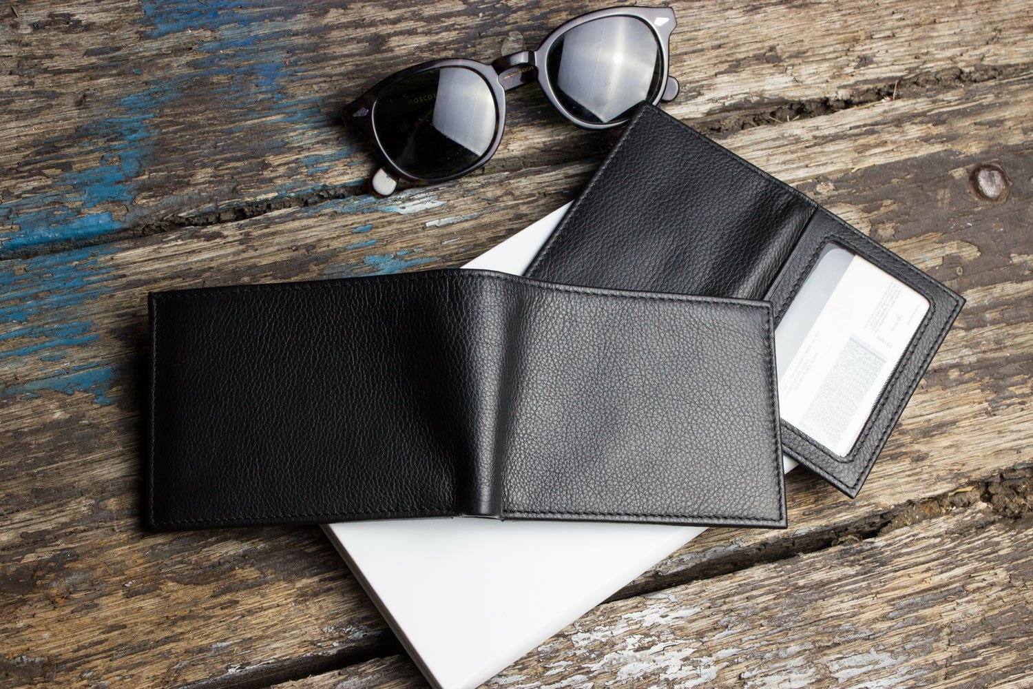 Traditional Bifold Wallet made of glove tanned cowhide leather with removable ID window and multiple card slots.