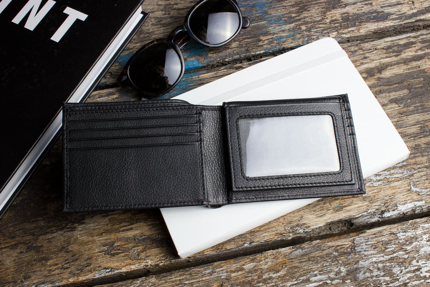 Traditional Bifold Wallet made of glove tanned cowhide leather with removable ID window and multiple card slots.