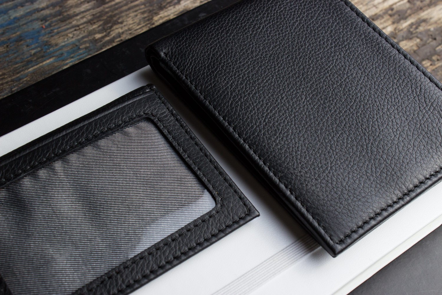 Traditional Bifold Wallet made of glove tanned cowhide leather with removable ID window and multiple card slots.